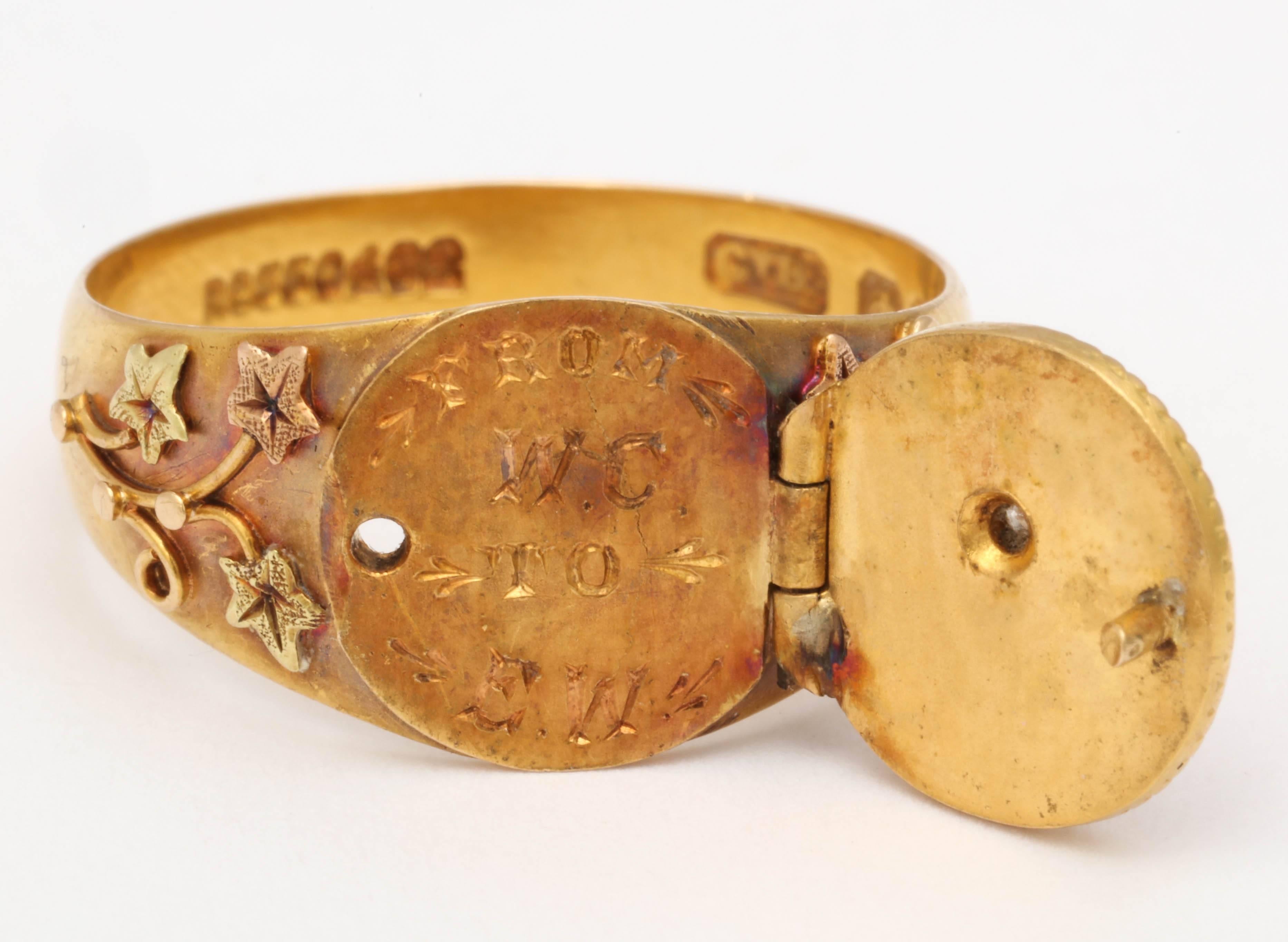 Flowers here, a daisy  for remembrance there carry the message of  love and admiration with  this 18kt ring with hidden initials under the locket. English hallmarks abound. Notice the floral sprays on the shoulders of the shank. They add lovely