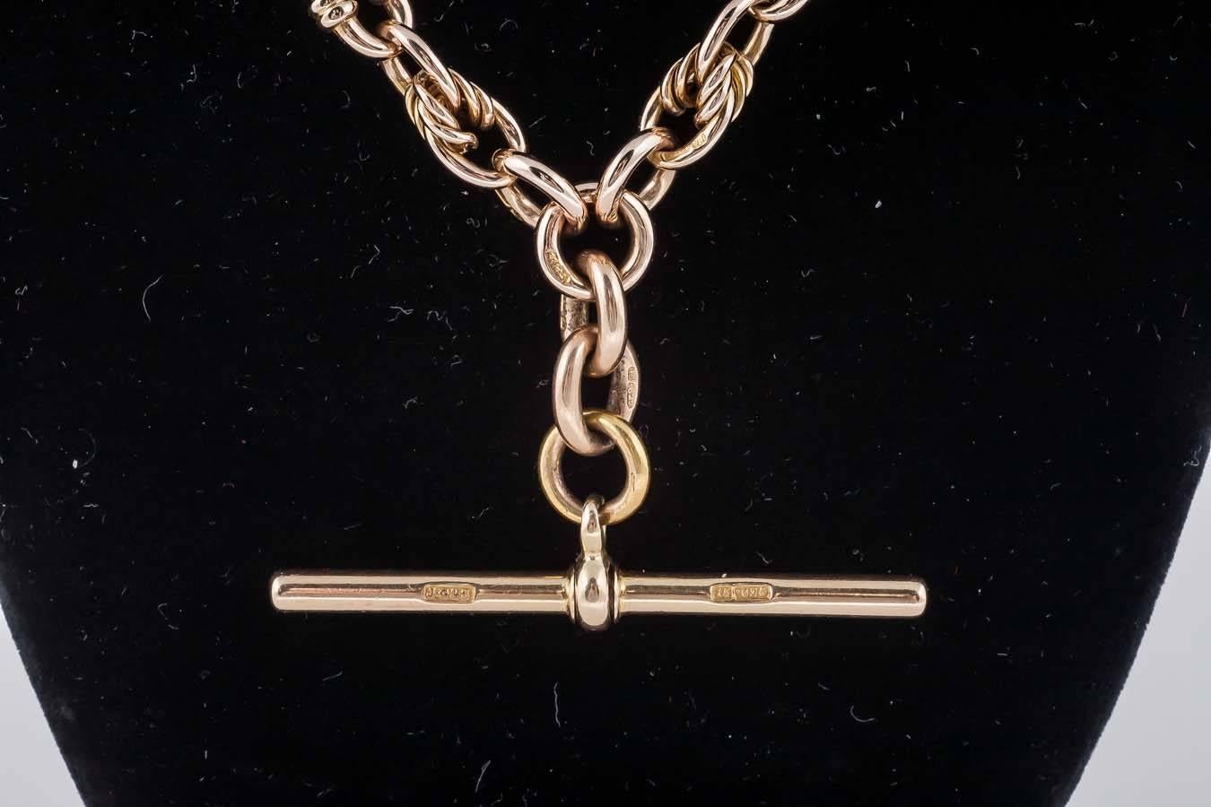 This Victorian knot and fetter link Albert watch chain has a T bar and dog clip fittings

