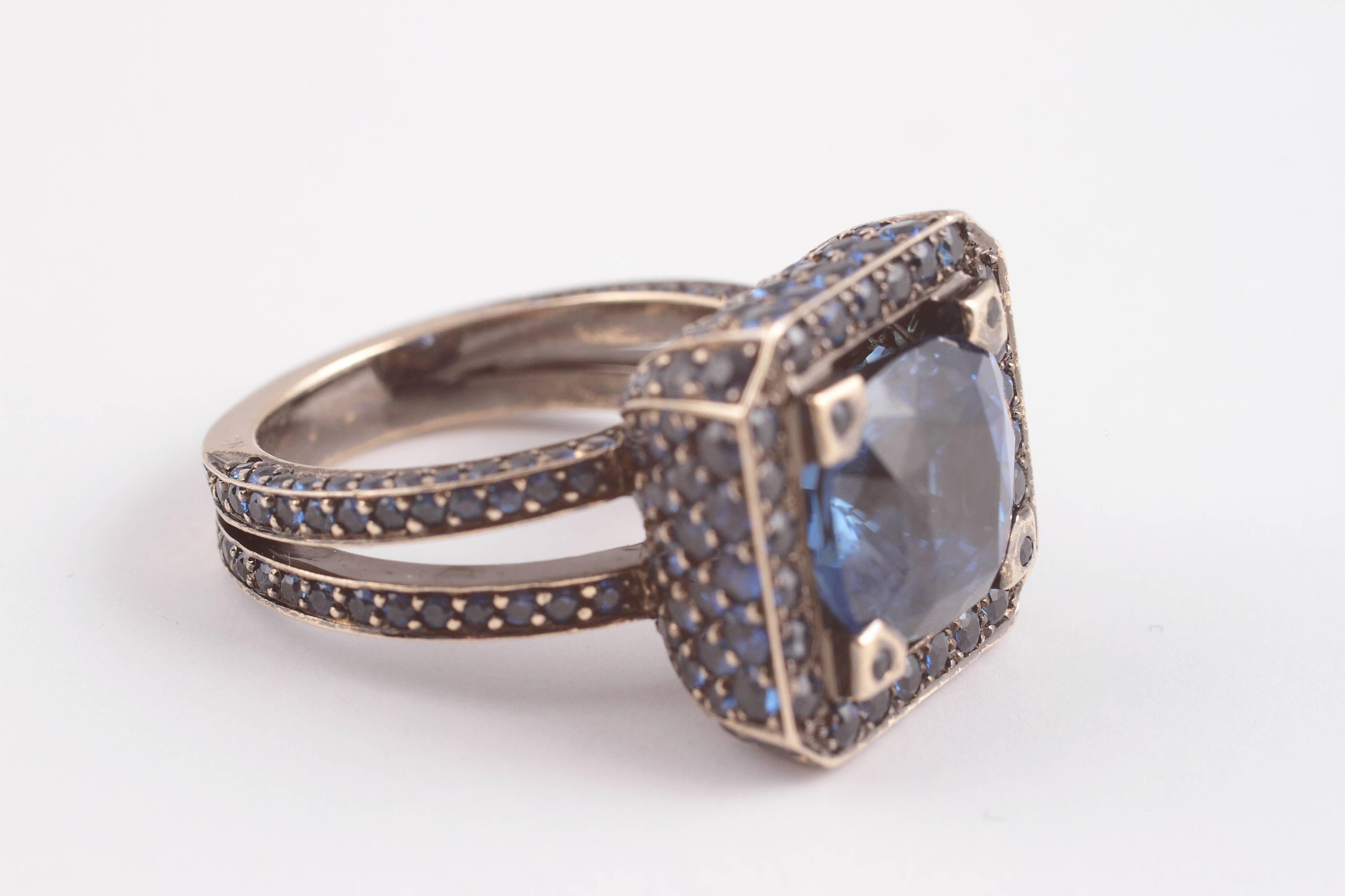 Beautiful in Blue.  This 6.00 ct Solange designed ring from London makes its mark by stepping out in grand style.  Lucky is the finger that wears this design.   size 6.5