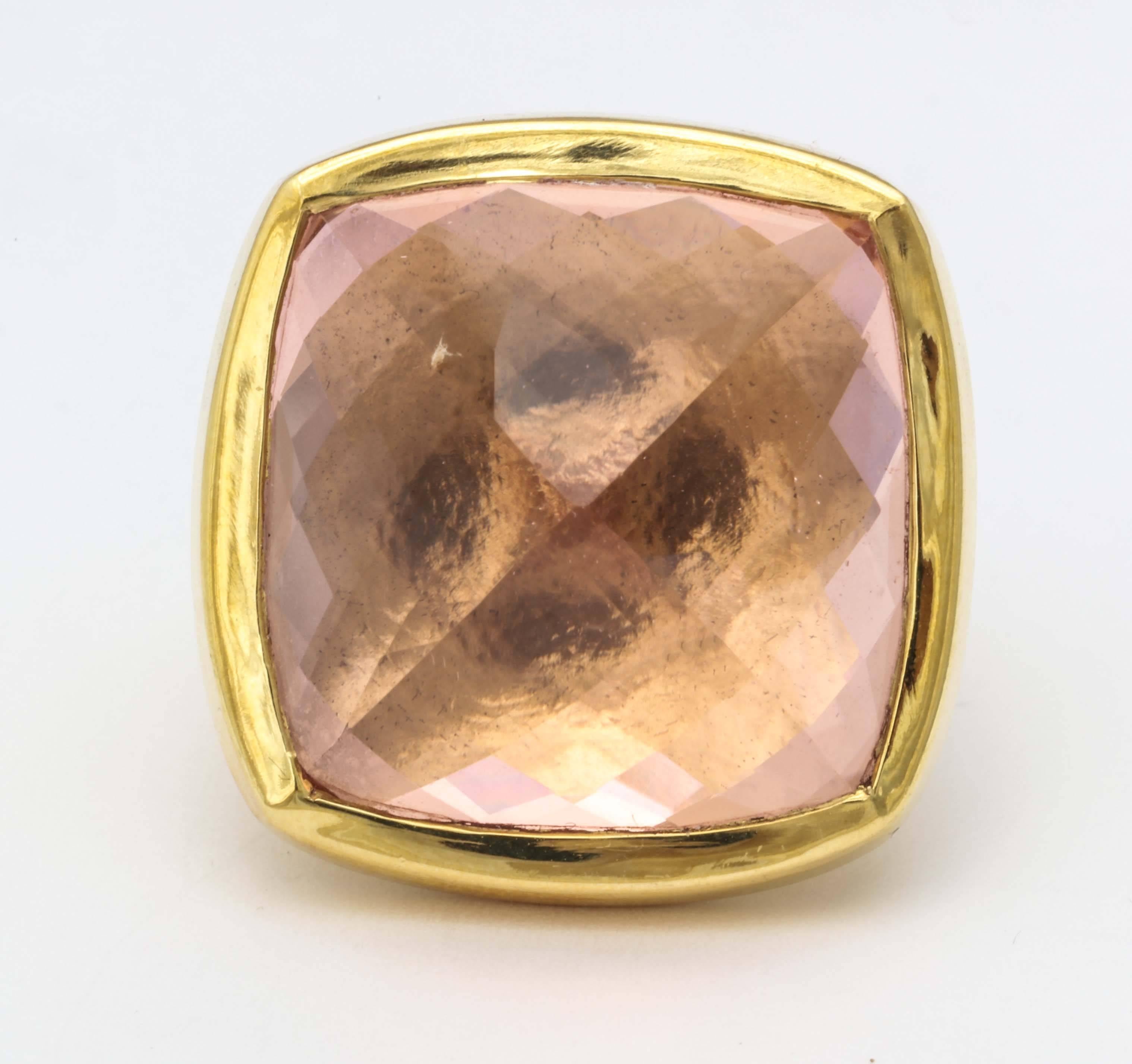 An 18kt yellow gold ring featuring a large faceted morganite which has been bezel set, and set upside down. size 6.75
Stone Height: .75 inch