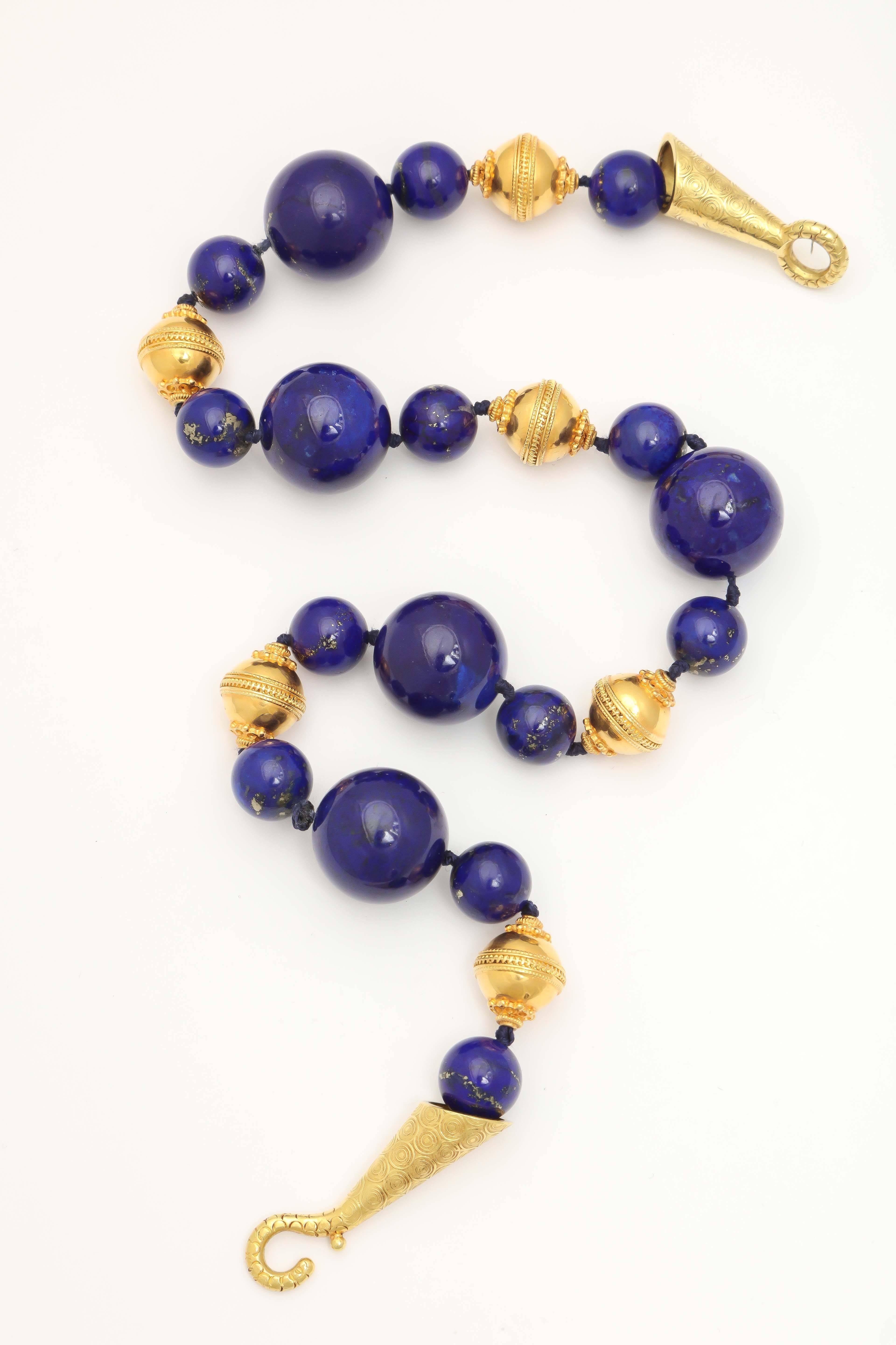 Sumptuous Russian Lapis Bead necklace with 6 Granulated 18t Gold Beads and 
fancy attenuated closure.  Ca 1960-l970.  