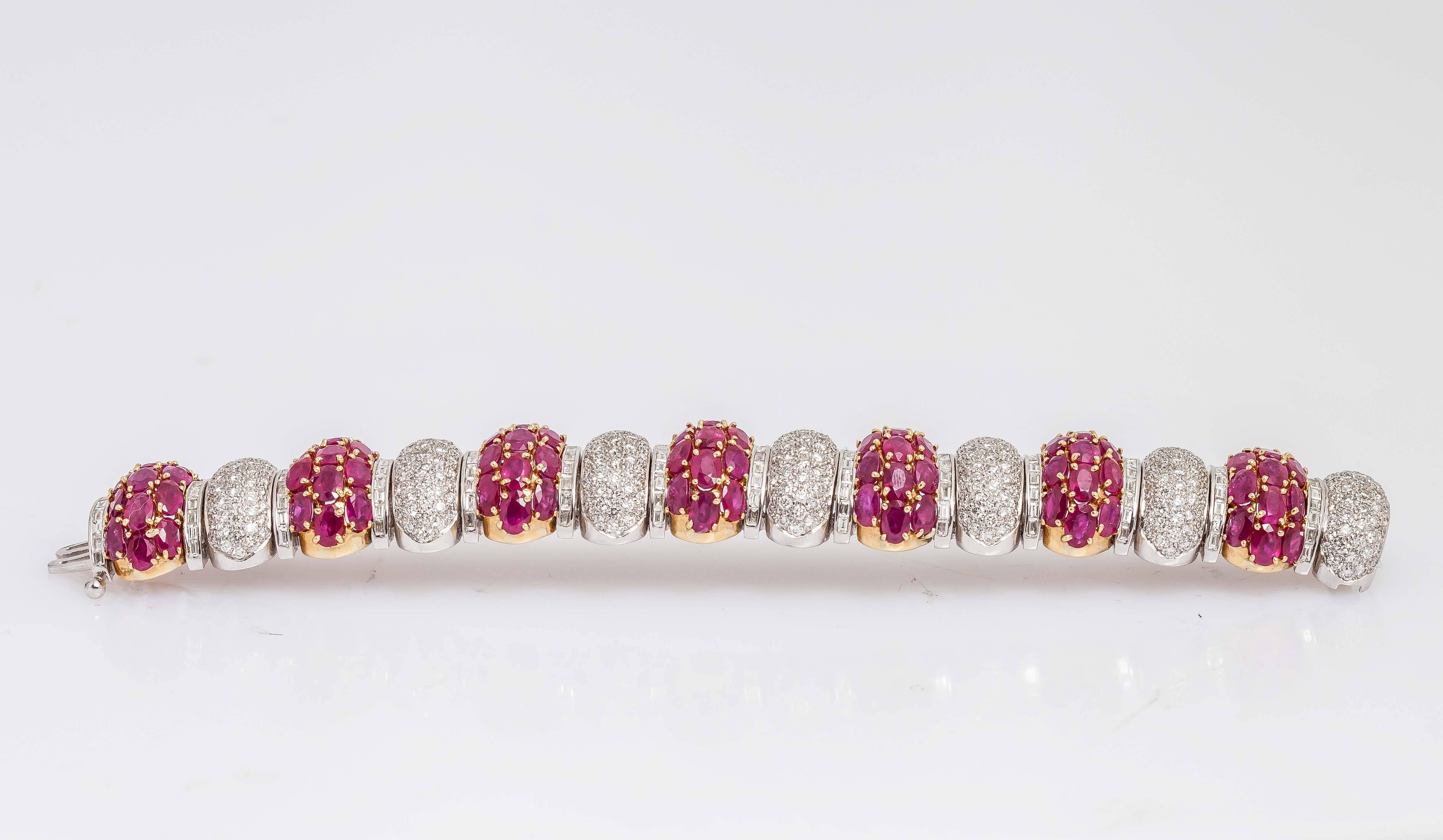 Beautiful bracelet finely crafted in 18k yellow and white gold. It has diamonds that weigh approx. 15.75 carats and rubies weigh approx. 52.39 carats.