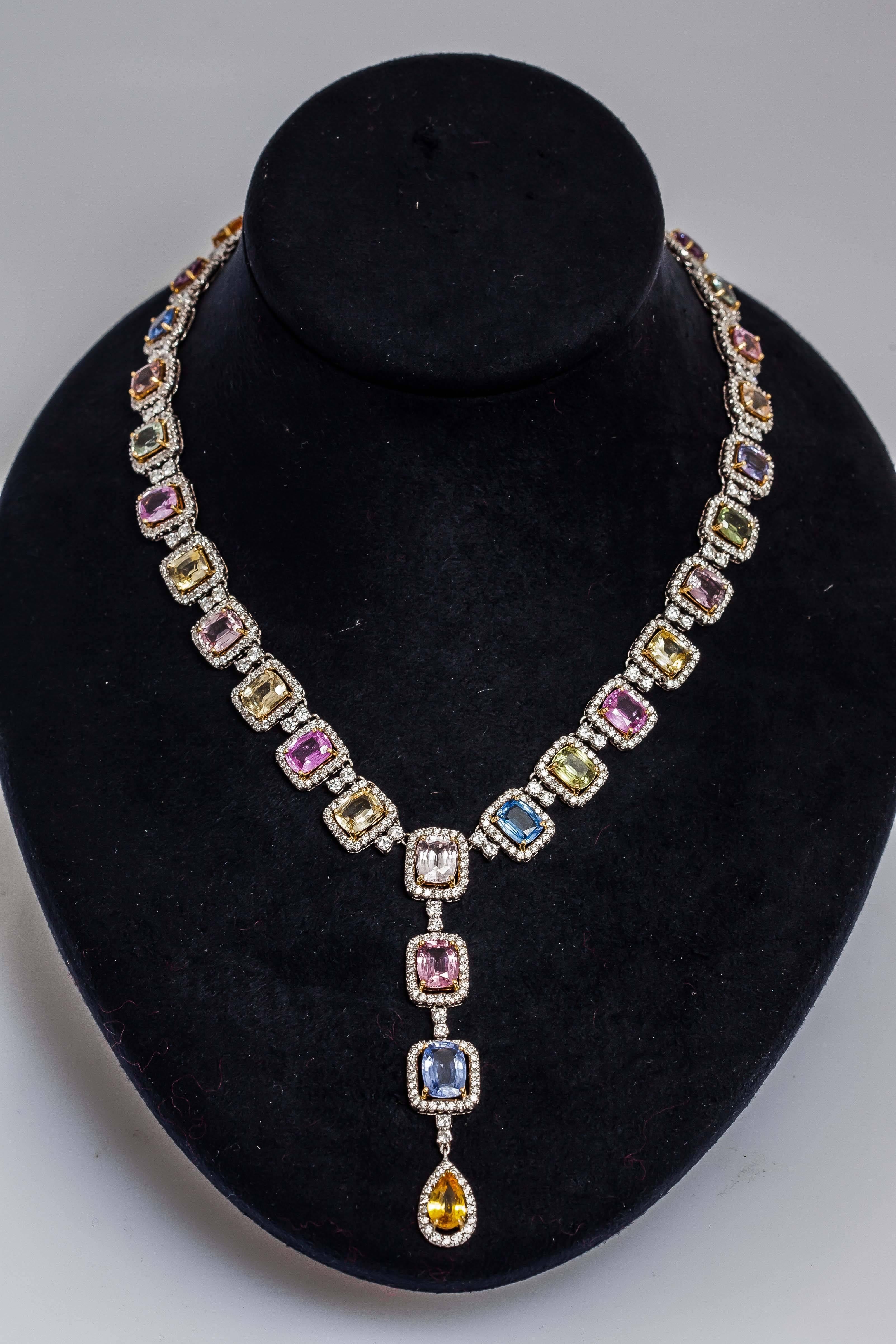 Beautiful multi-color sapphire necklace finely crafted in 18k white gold, with pink, light and dark yellow, blue, green sapphires weighing approx. 55.24 carats and round brilliant cut diamonds weighing approx.13.22 carats.