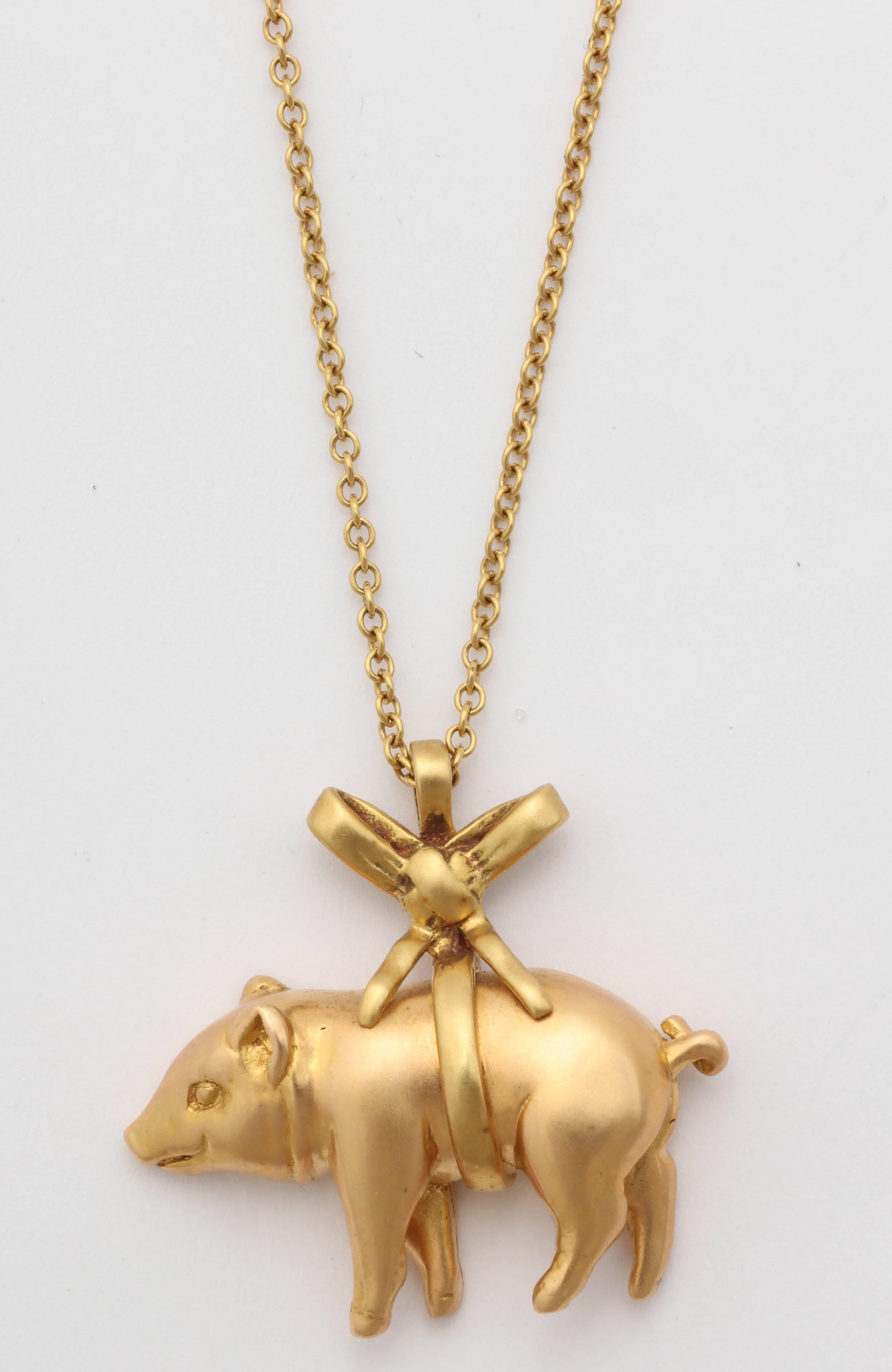 Charming little rose gold pig pendant wrapped in a ribbon of 18kt yellow gold. 
Can be worn as a pendant or attached to a charm bracelet.
Chain sold separately.