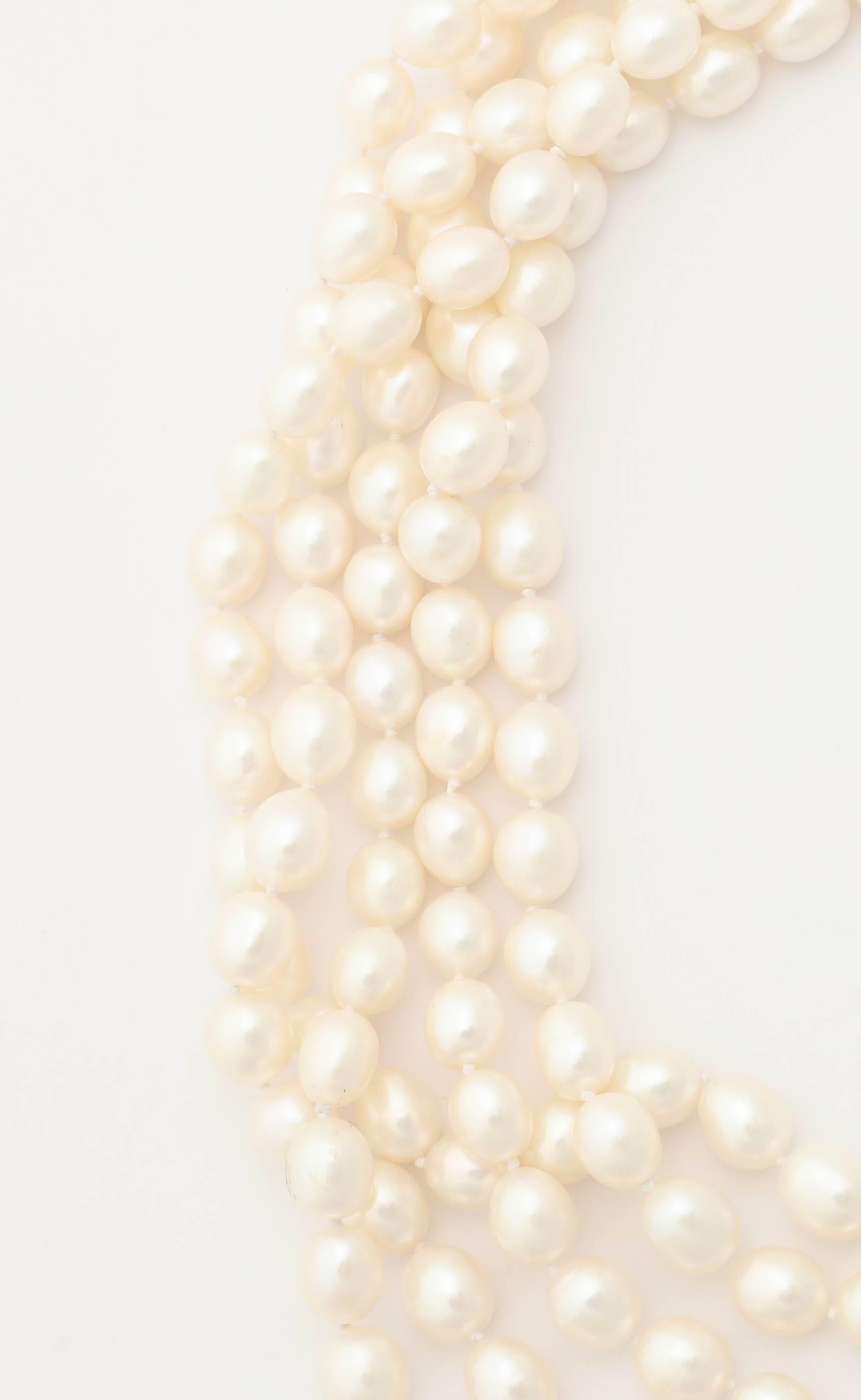 This extra long fresh water pearl necklace can be worn many ways, it's up to your imagination. There is a knot in between each pearl for strength and it is continuous ( no clasp). The pearls are approximately 10 mm by 8 mm.  and a beautiful,