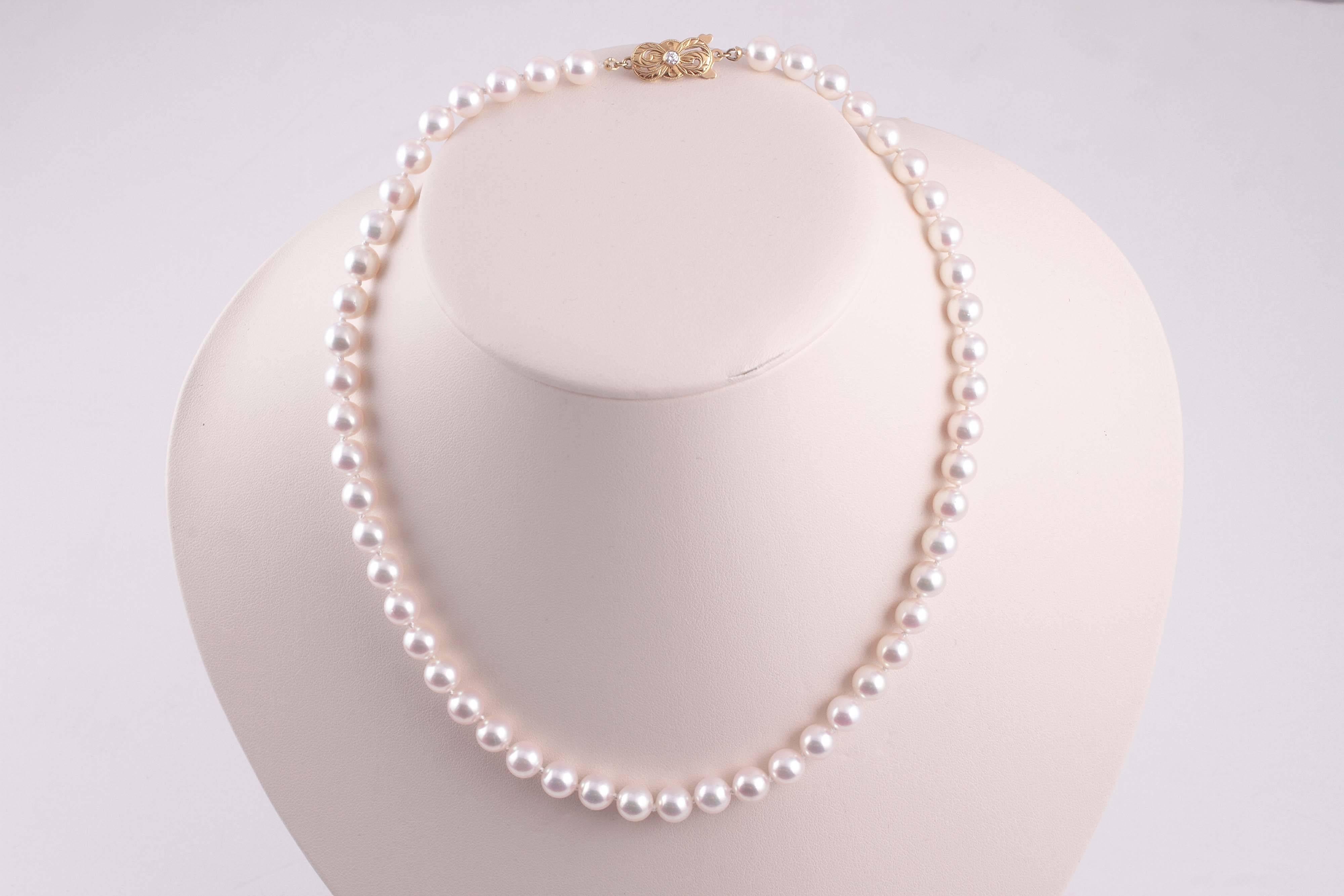 18 karat yellow gold clasp, 7.00 mm - 7.50 mm pearls. accent diamond clasp.  A classic beauty that is always in style and Mikimoto is always in demand.    