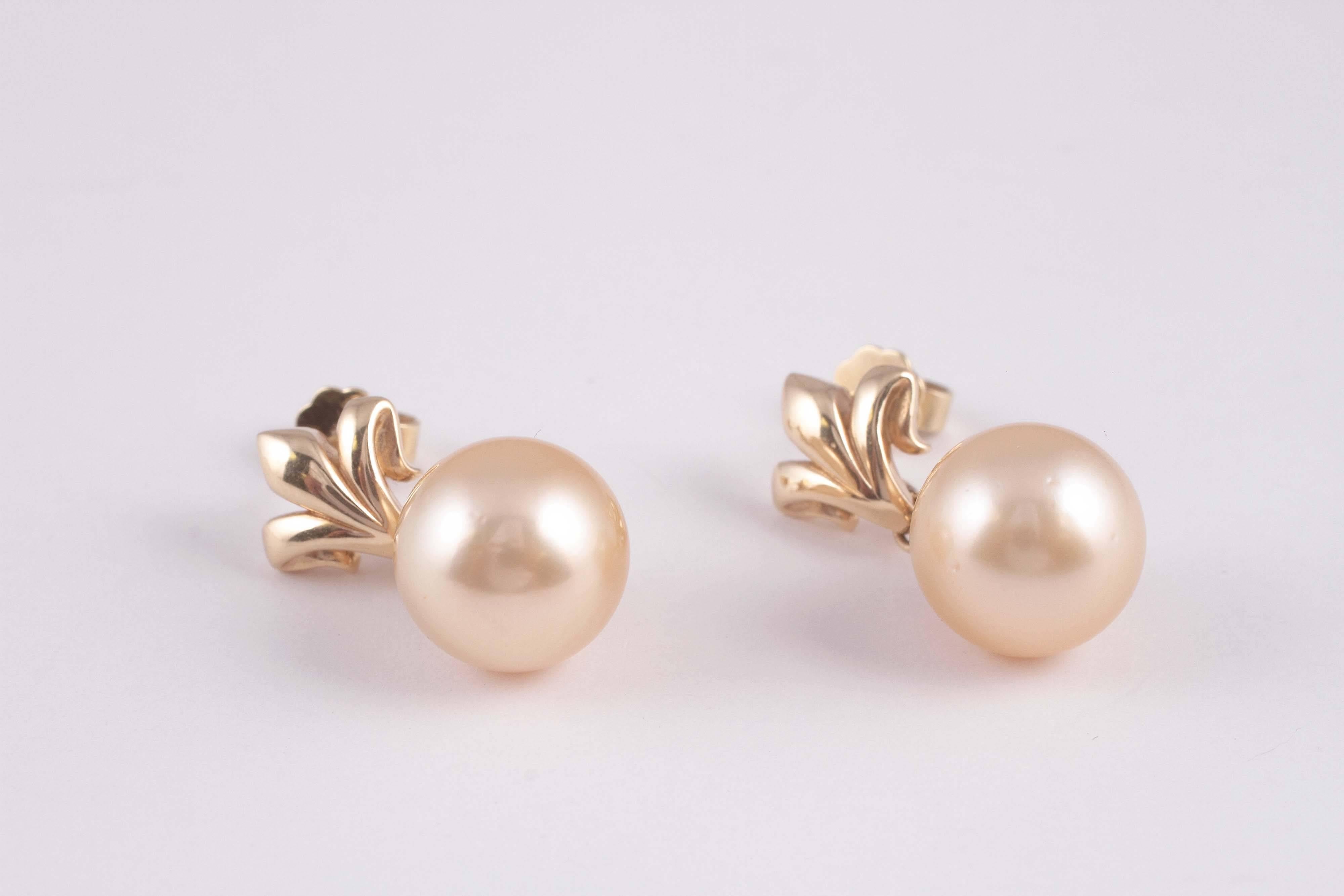 Gold Fleur De Lis tops sporting 12.00 mm yellow pearls.  So pretty and yet so sophisticated.  Simply elegant.  