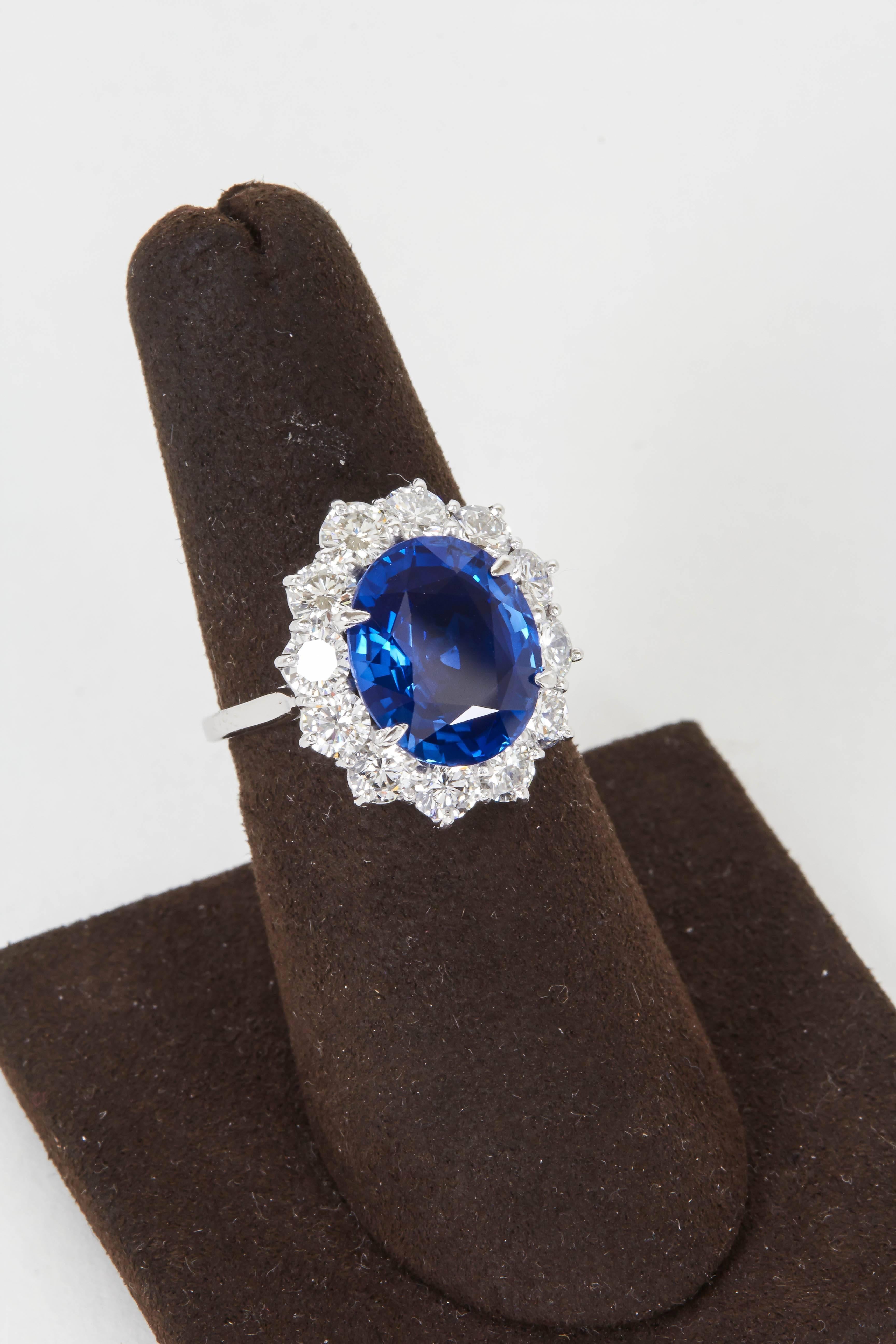 

A beautiful sapphire set in an elegant and timeless ring. 

6.02 carat oval fine blue sapphire, with exceptional color and brilliance, set in a platinum and diamond mounting featuring 2.88 carats of F color VS clarity round brilliant cut