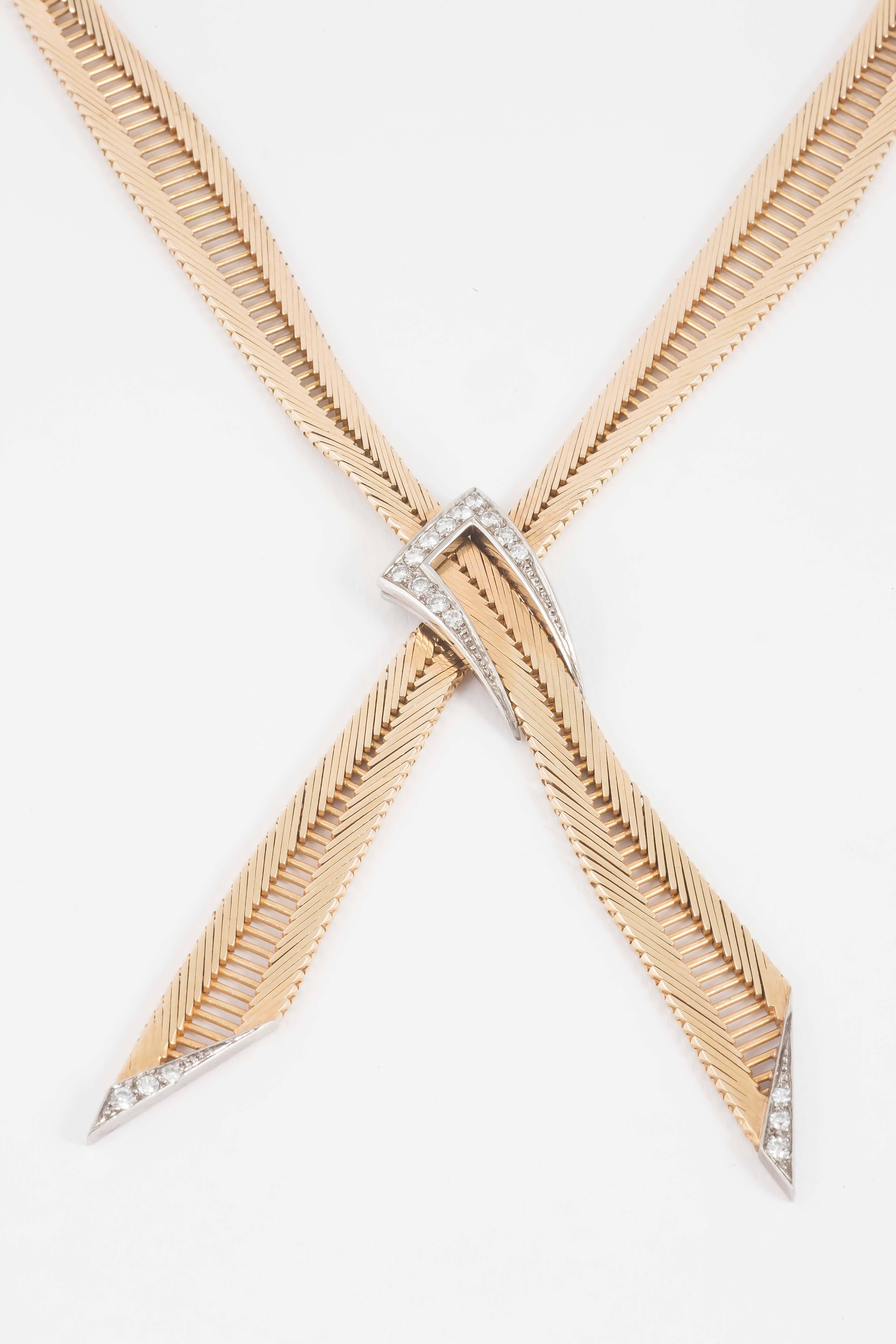 A finely made French 18ct gold Necklace of tapering form tied at the centre with a diamond knot and diamond set terminals. c,1950