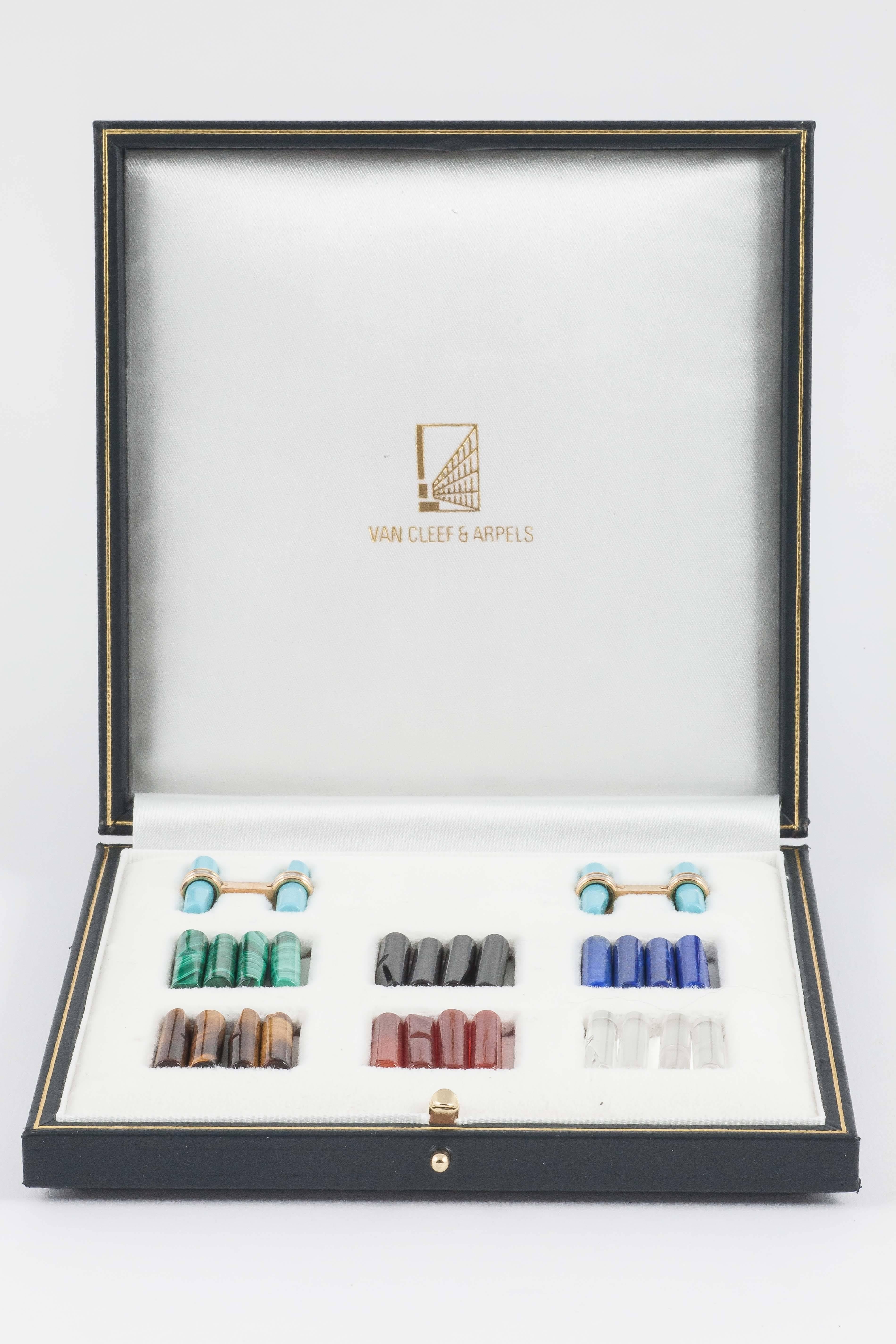 A set of coloured stone baton cufflinks by Van Cleef and Arpels in 18ct gold with interchangeable batons,Turquoise,Malachite,onyx,Lapis Lazuli,Tigers Eye,Cornelian,Crystal.Numbered B9107198.Stamped Or 750 and VCAwith french Eagles head stamp