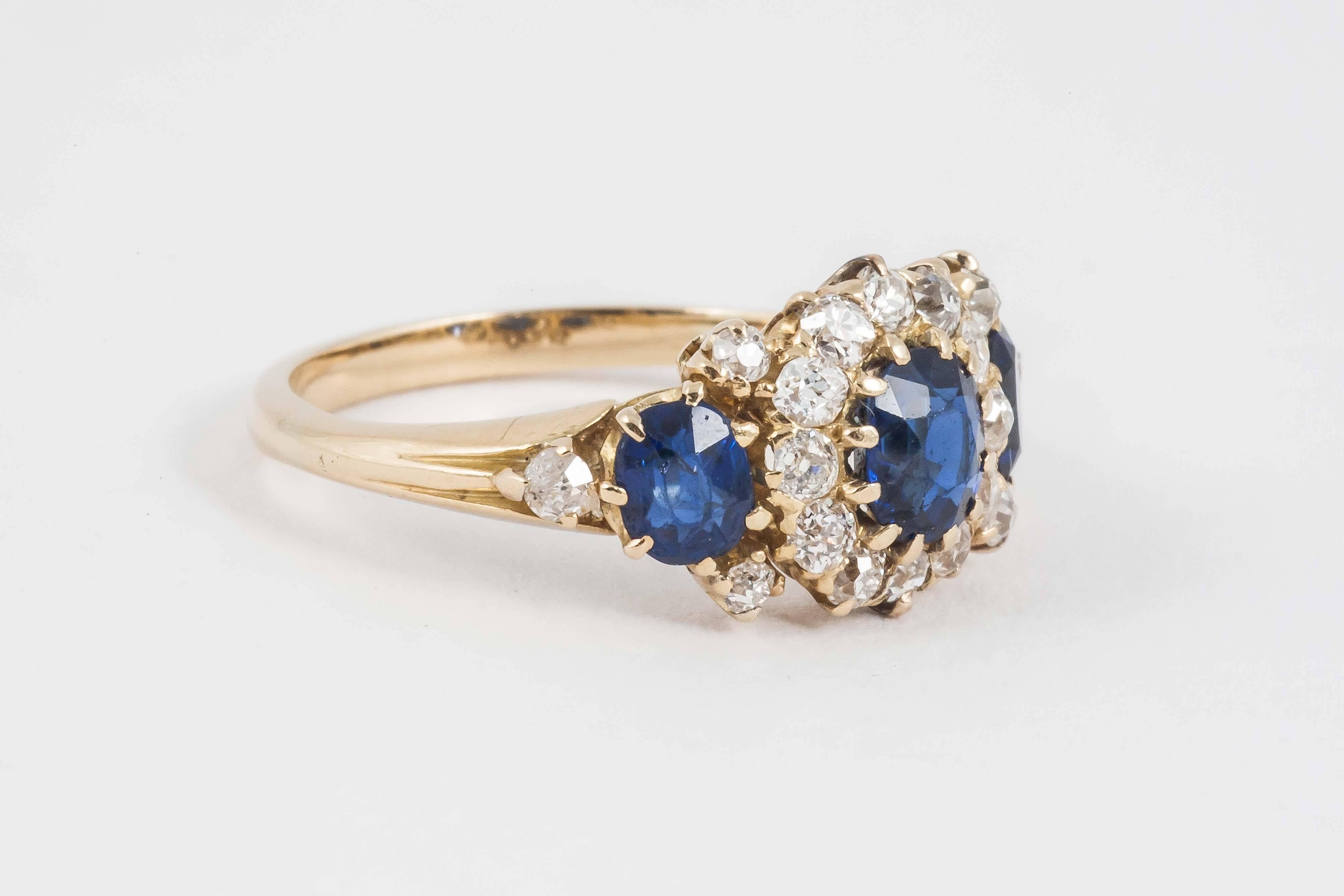 A 19th century, ceylon sapphire 3 stone ring set with old cut brilliant diamonds,mounted in 18ct gold.c,1880