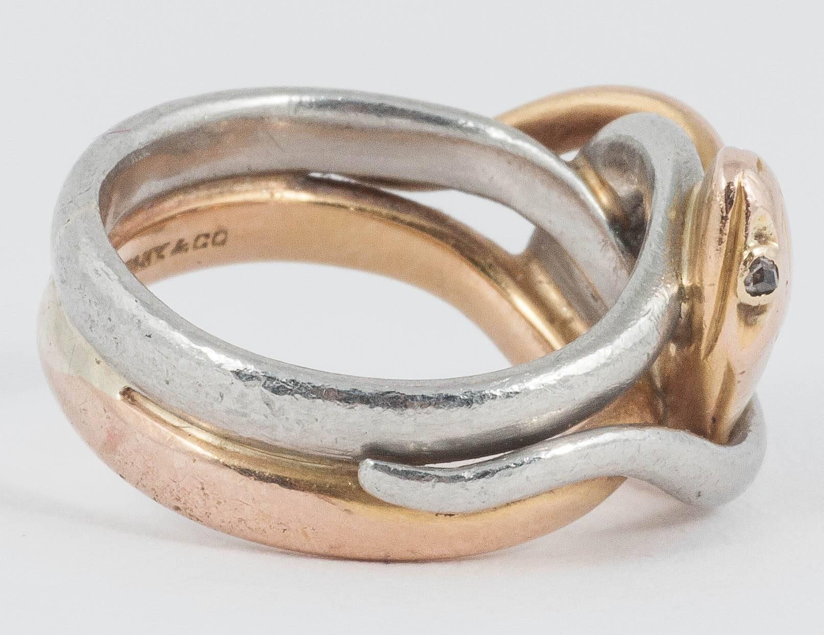 Tiffany double snake ring made in Platinum and 18ct Gold. Gem set eyes

Finger size K