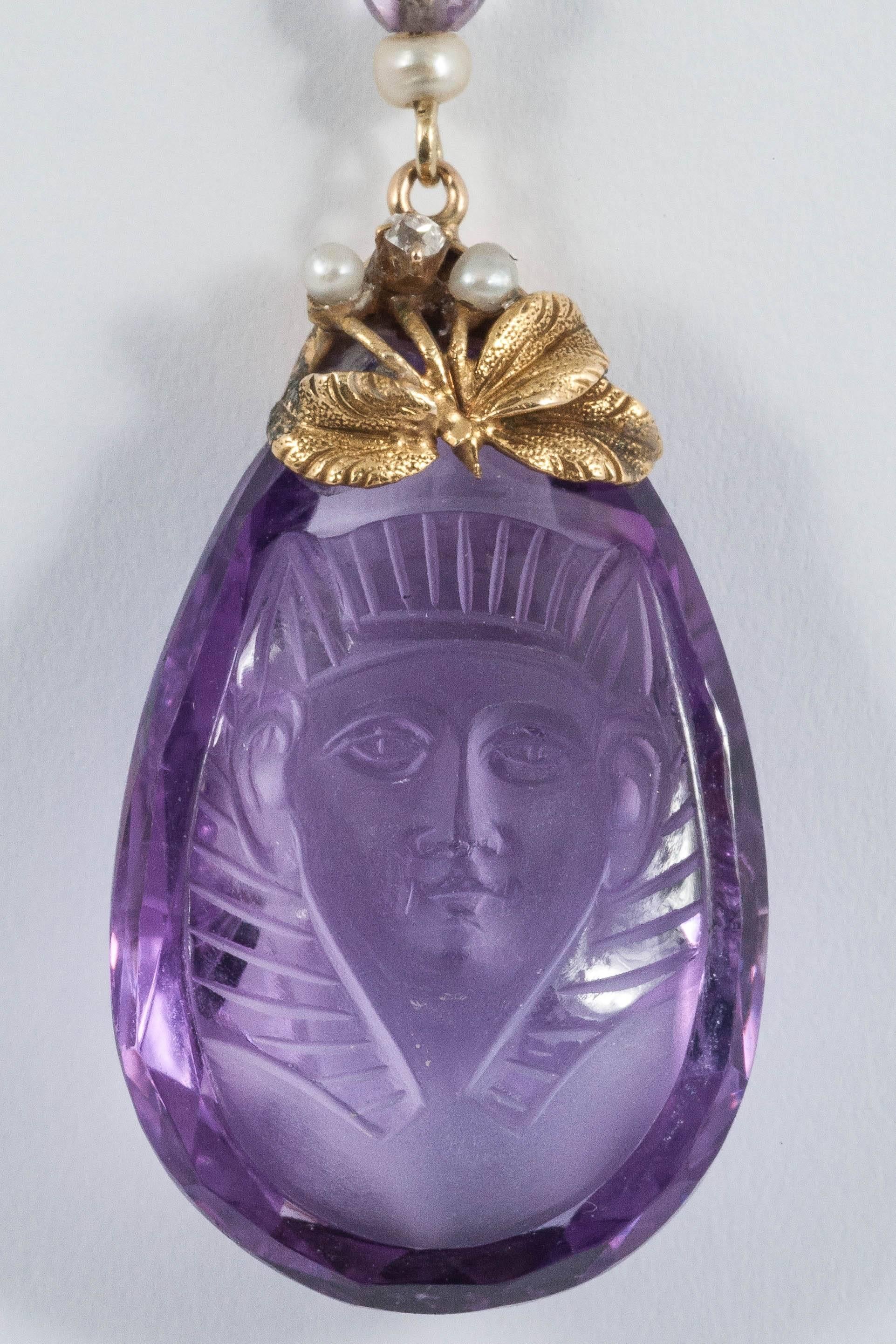 Carved Amethyst of Egyptian face on integrated gem set chain set with pearls