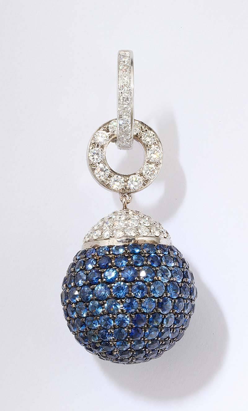 18k white gold pave sapphire orbs set with 370 brilliant sapphires 3.88 carats  topped by 108 round diamonds 2.35 carats
they are detachable from the hoop earrings and can suspended fro many clip back earrings.