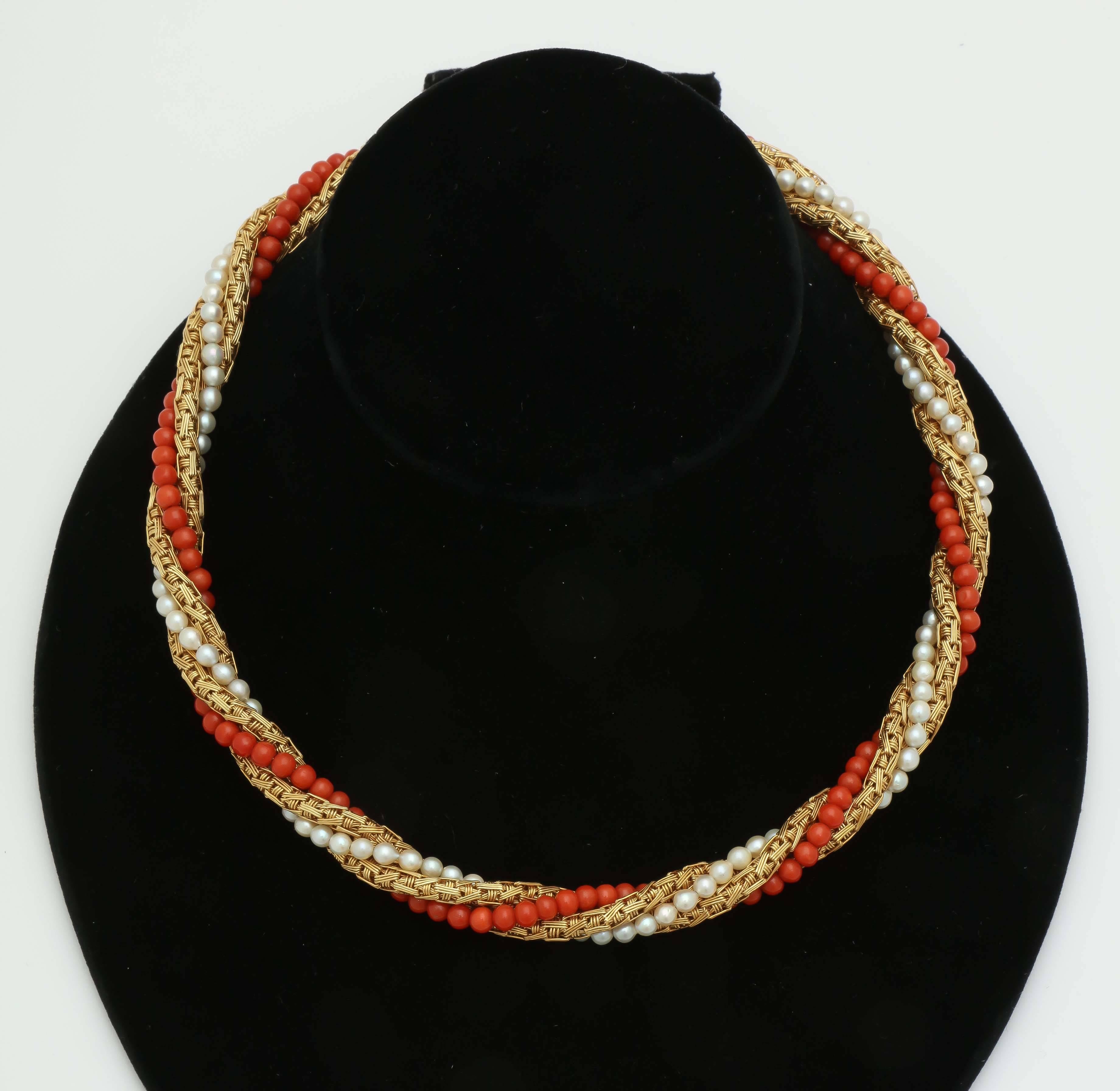 18kt Yellow Gold Chic Necklace Comprised Of Numerous Beautiful Color Coral Accents and intertwined with numerous High Quality Cultured Round Pearls . Coral and Pearl Stones Approximately 3MM Each.Exhibiting Beautiful Gold Textured Craftmanship his