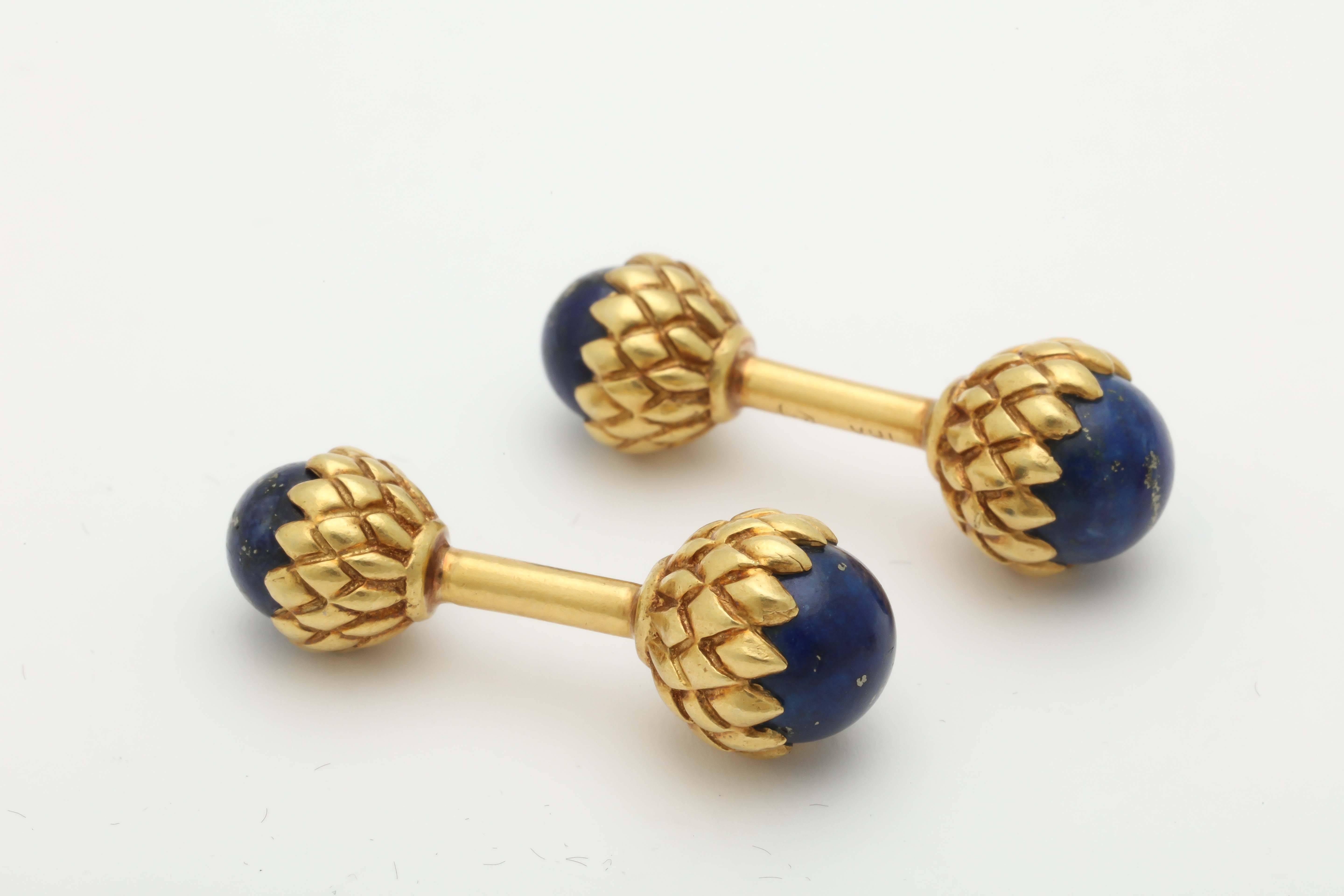 18kt yellow gold acorn pattern stud set included in Dress Set are 3 Studs with cabochon set Lapis Lazuli Stones and Further decorated with acorn pattern gold workmanship. Included in set are a Pair of double-sided cufflinks with lapis lazuli stones