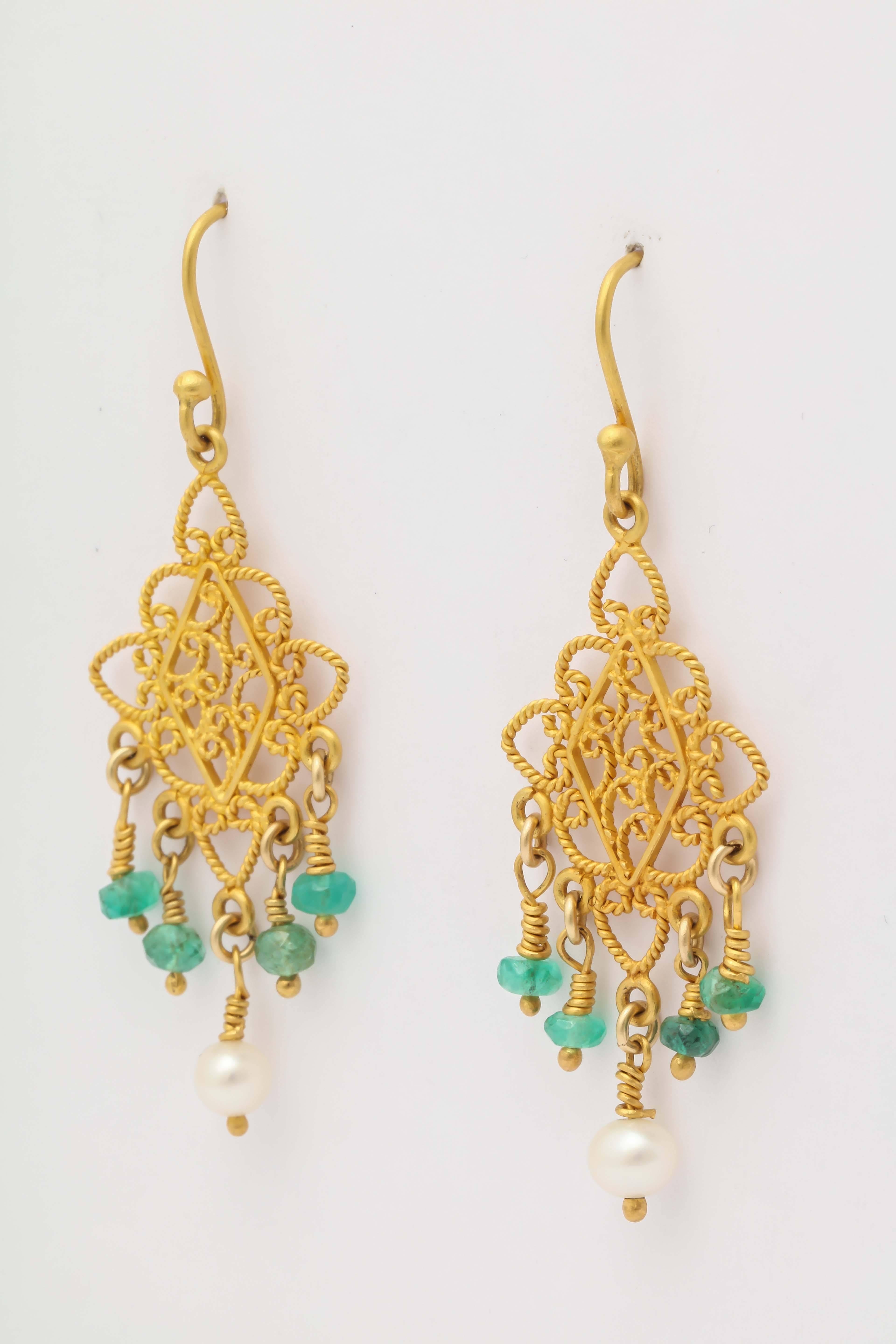These are an elegant and classic design.  The earrings are 18 kt and plated with 24 kt. The color is extremely rich and goes well with the precious emerald  beads.
The total length from the top of the wire to the pearl is approximately 2 in. and
