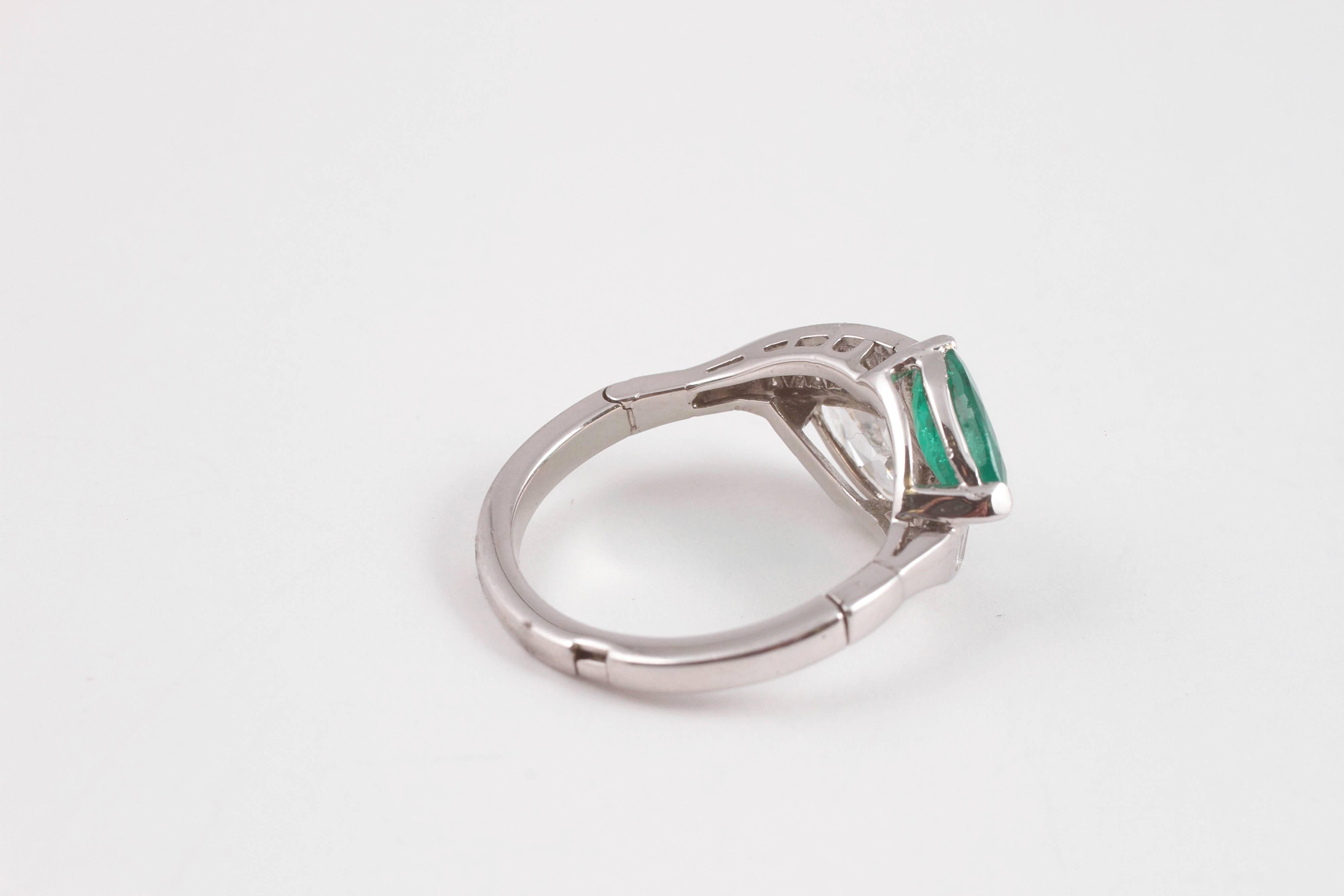 Women's 1950s 1.08 Carat Emerald 0.83 Carat Diamond Platinum Bypass Ring