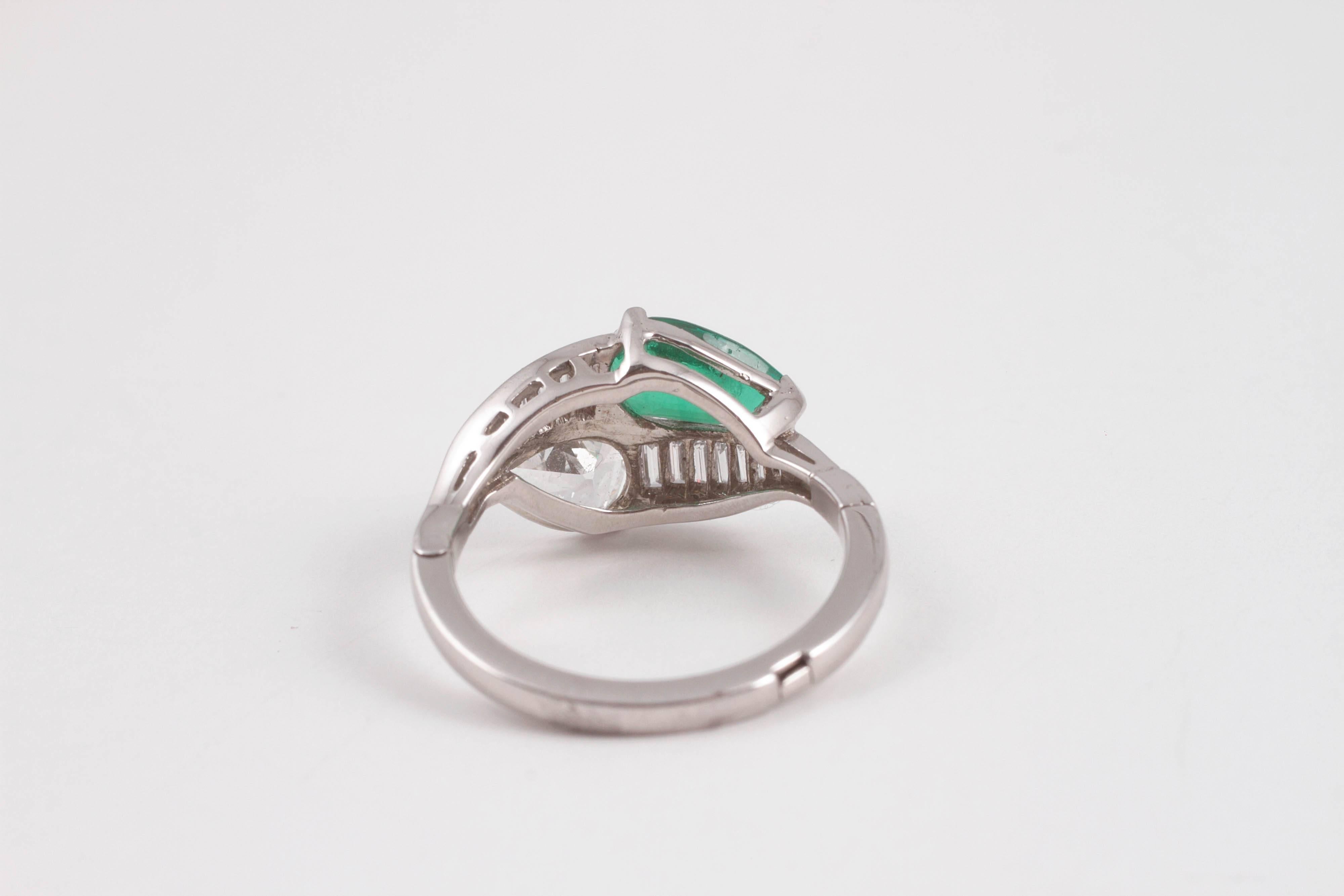1950s 1.08 Carat Emerald 0.83 Carat Diamond Platinum Bypass Ring 1