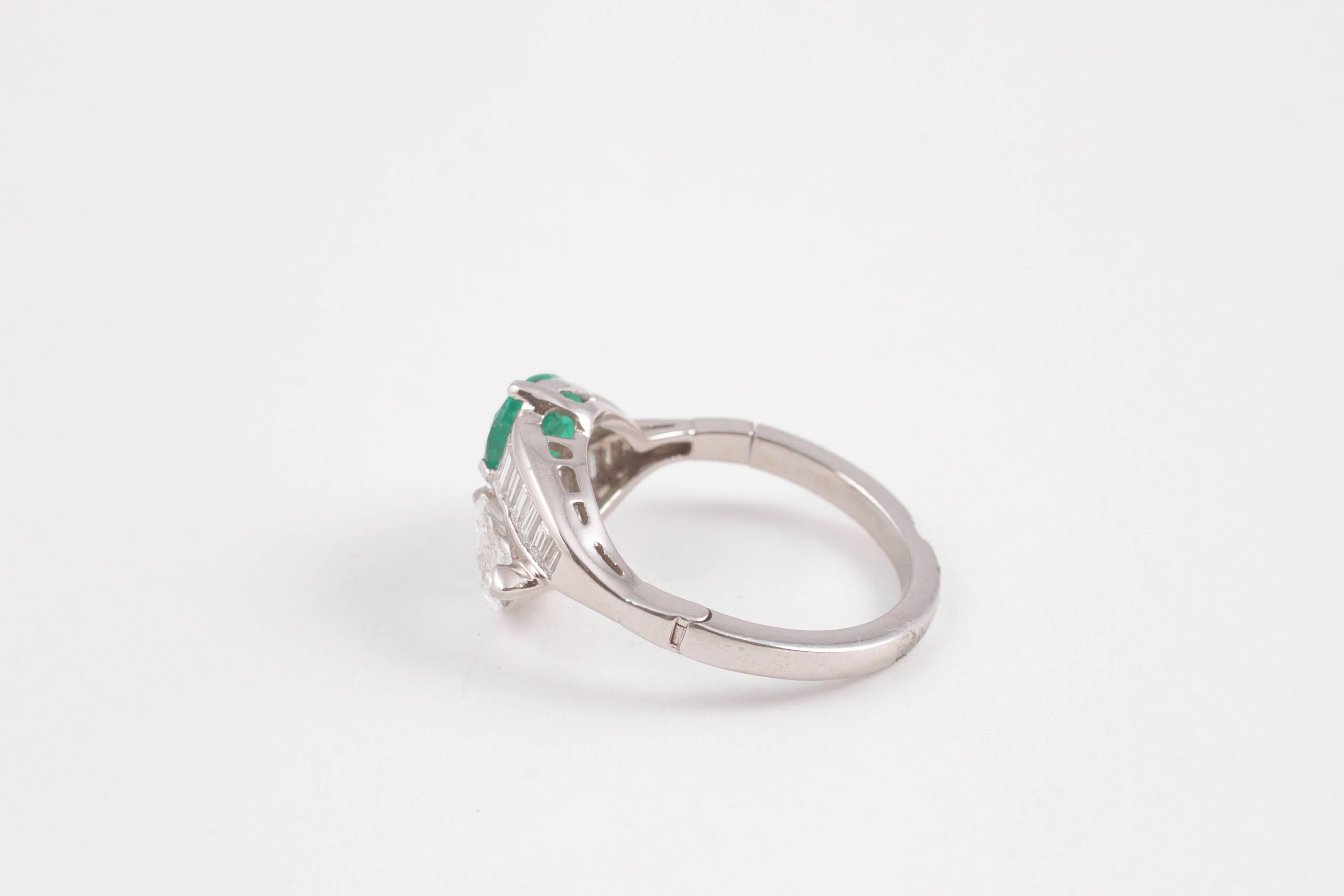 1950s 1.08 Carat Emerald 0.83 Carat Diamond Platinum Bypass Ring 2