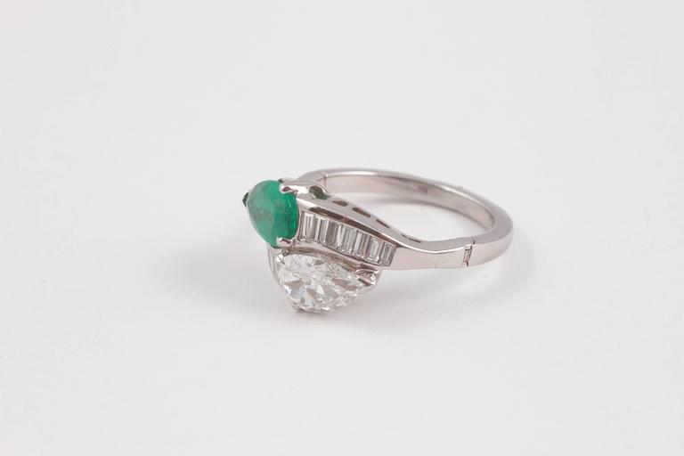 1950s 1.08 Carat Emerald 0.83 Carat Diamond Platinum Bypass Ring at 1stDibs