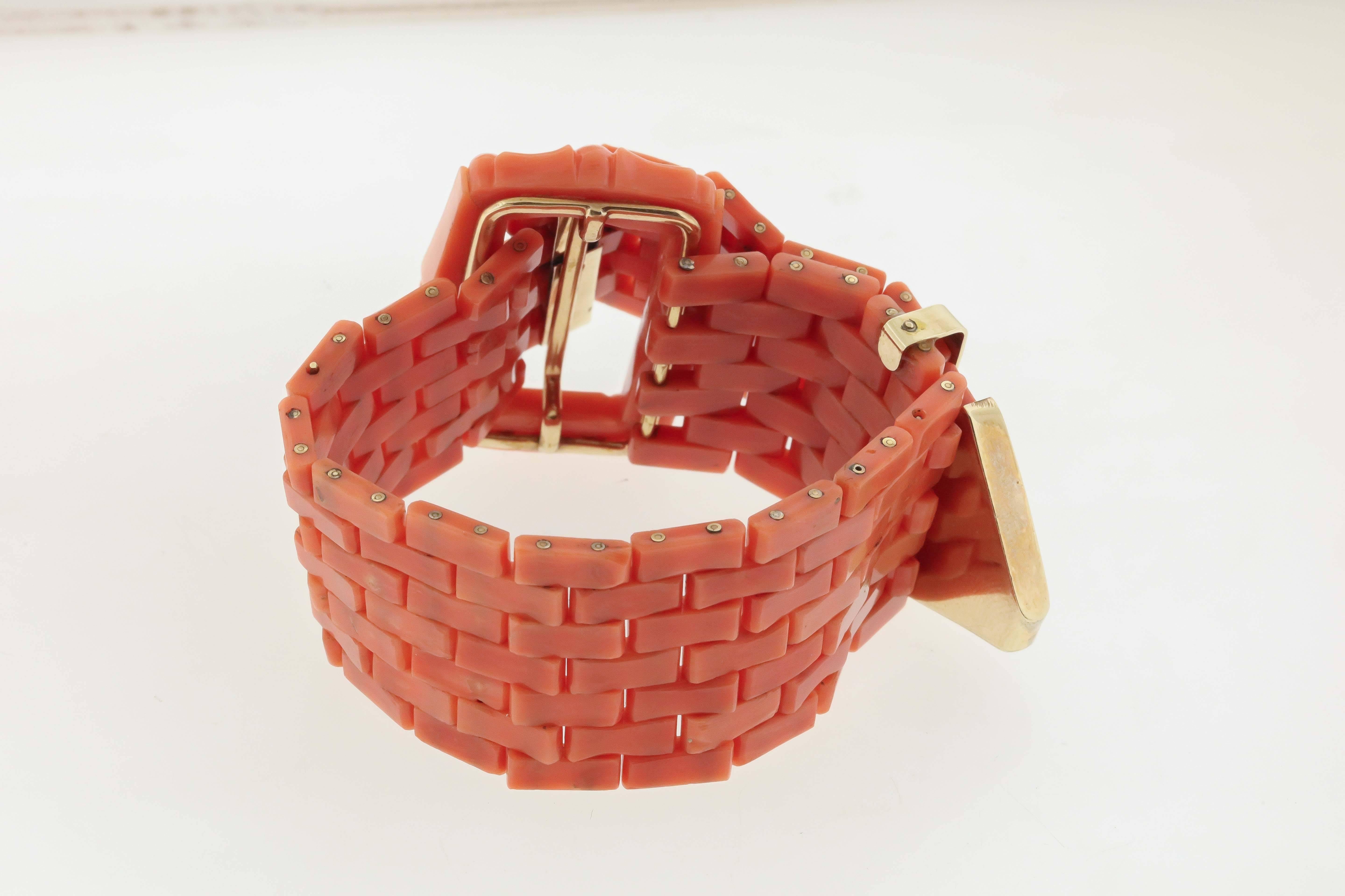 Antique coral brickwork link bracelet, circa 1900, is constructed of rectangular links of coral with gold rivets, 18K gold tongue and keeper and carved coral buckle.  Measures 1