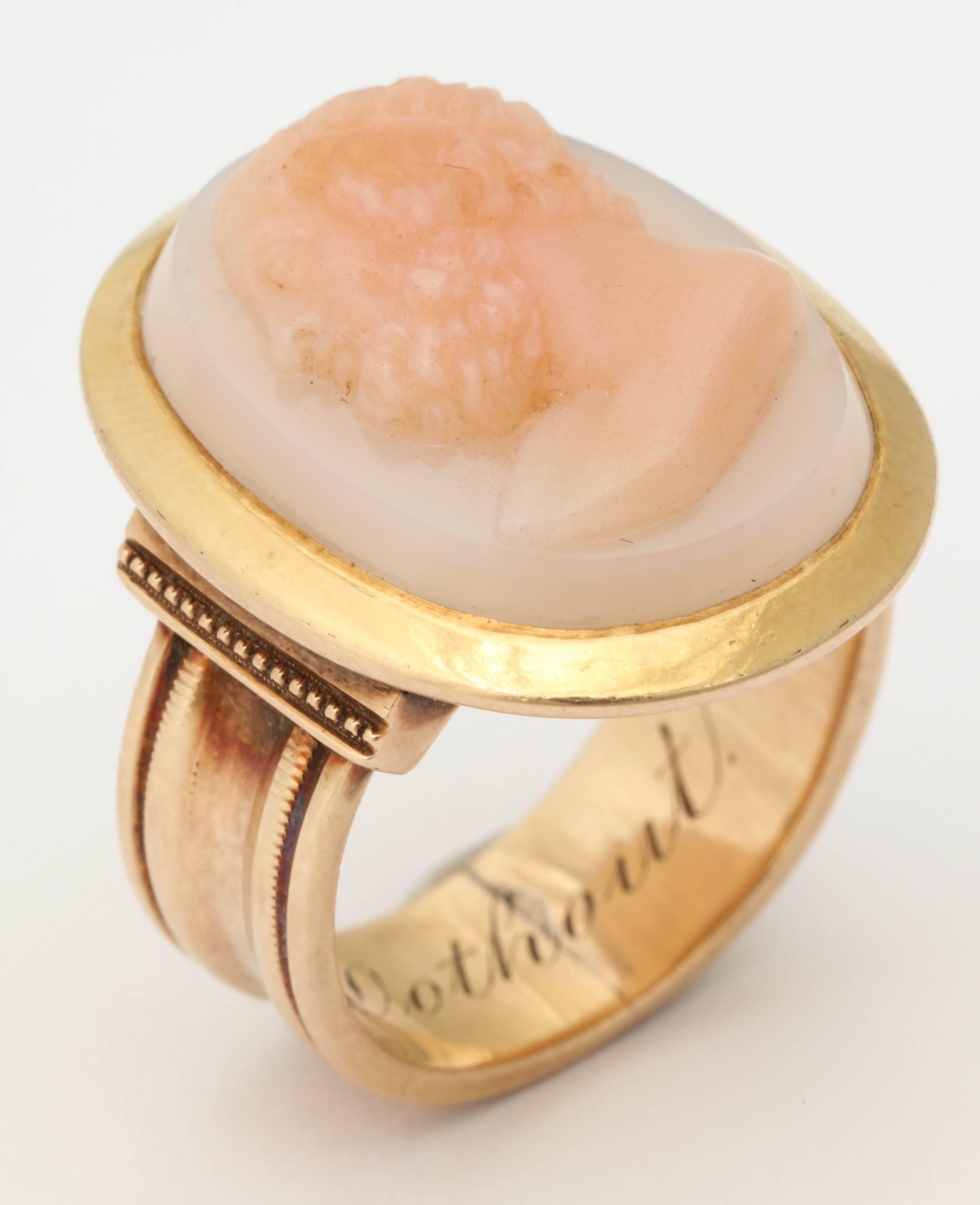 Direct from the family, this beautiful cameo ring was passed down from the early part of the 20th century and still has the family name engraved inside. The hard stone cameo, inspired by antiquity, is of an unknown man. 