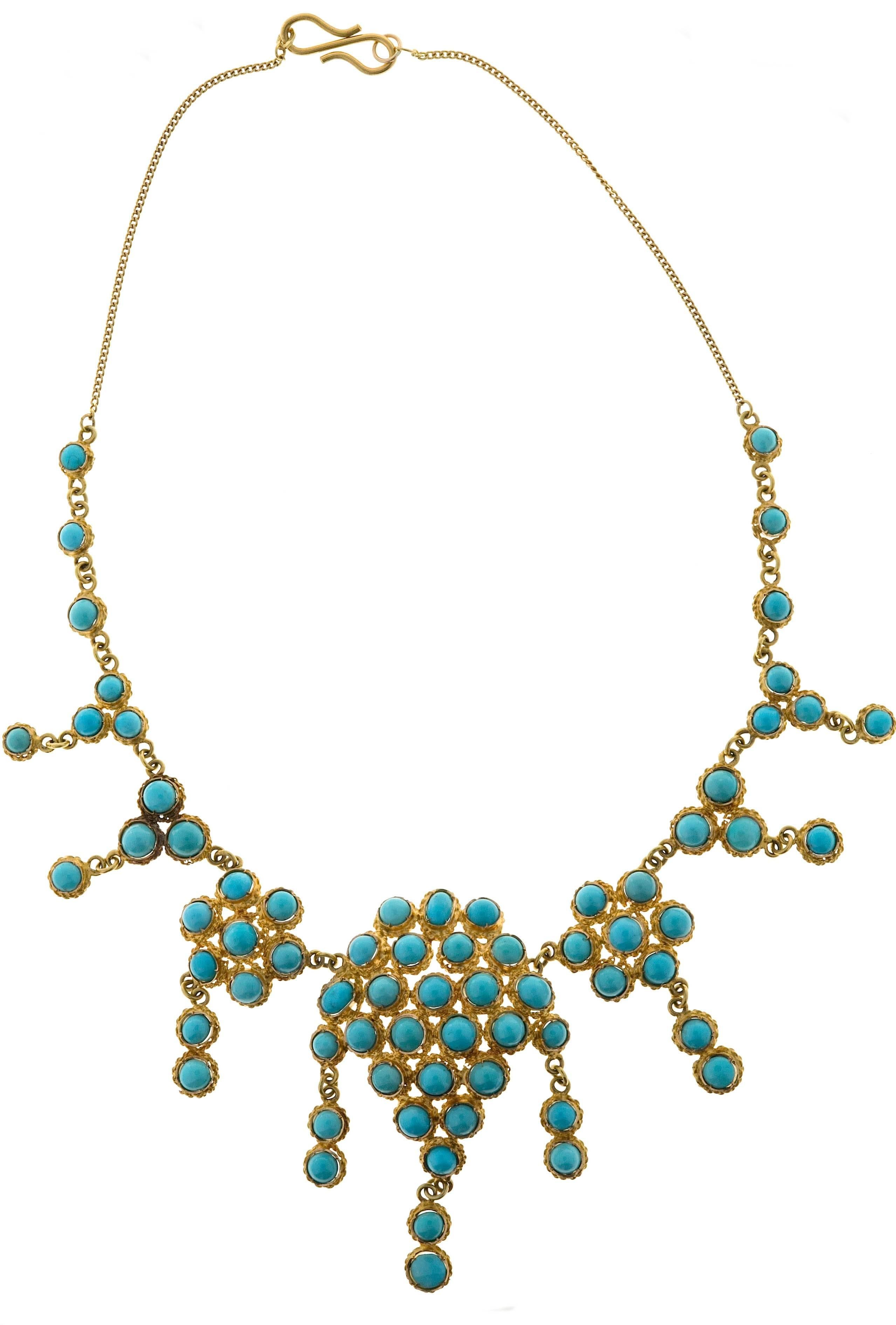 This statement festoon necklace is hand made in 18 kt. gold with beautiful matured Persian turquoise natural stones. A 'One Of A Kind