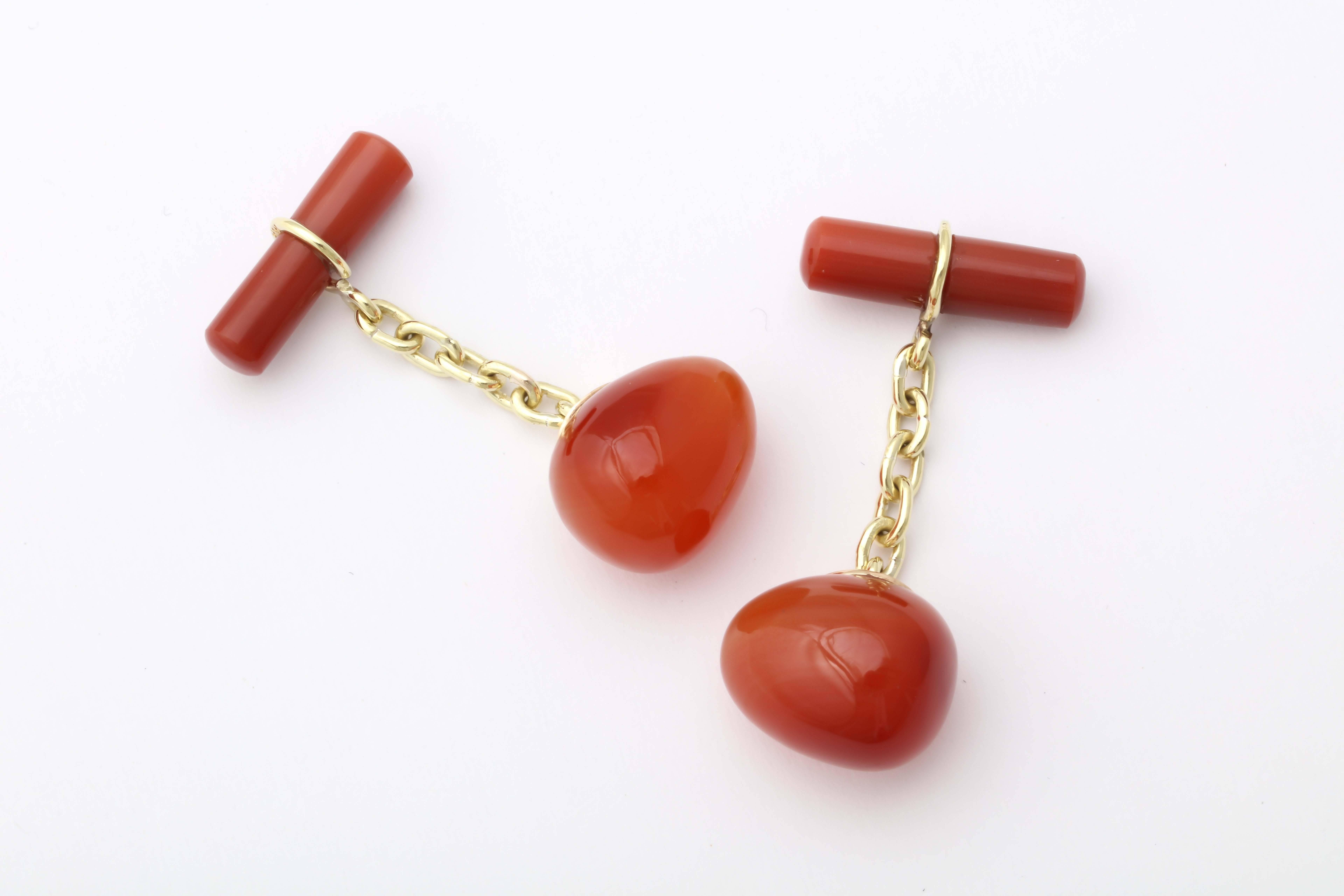 A fine pair of hand-carved egg-shaped carnelian cufflinks based on a Russian design from 1880 by the Fabergé workmaster, Erik Kollin. The well-matched orange carnelian links recall the highest quality Russian indigenous stone used in Fabergé animal