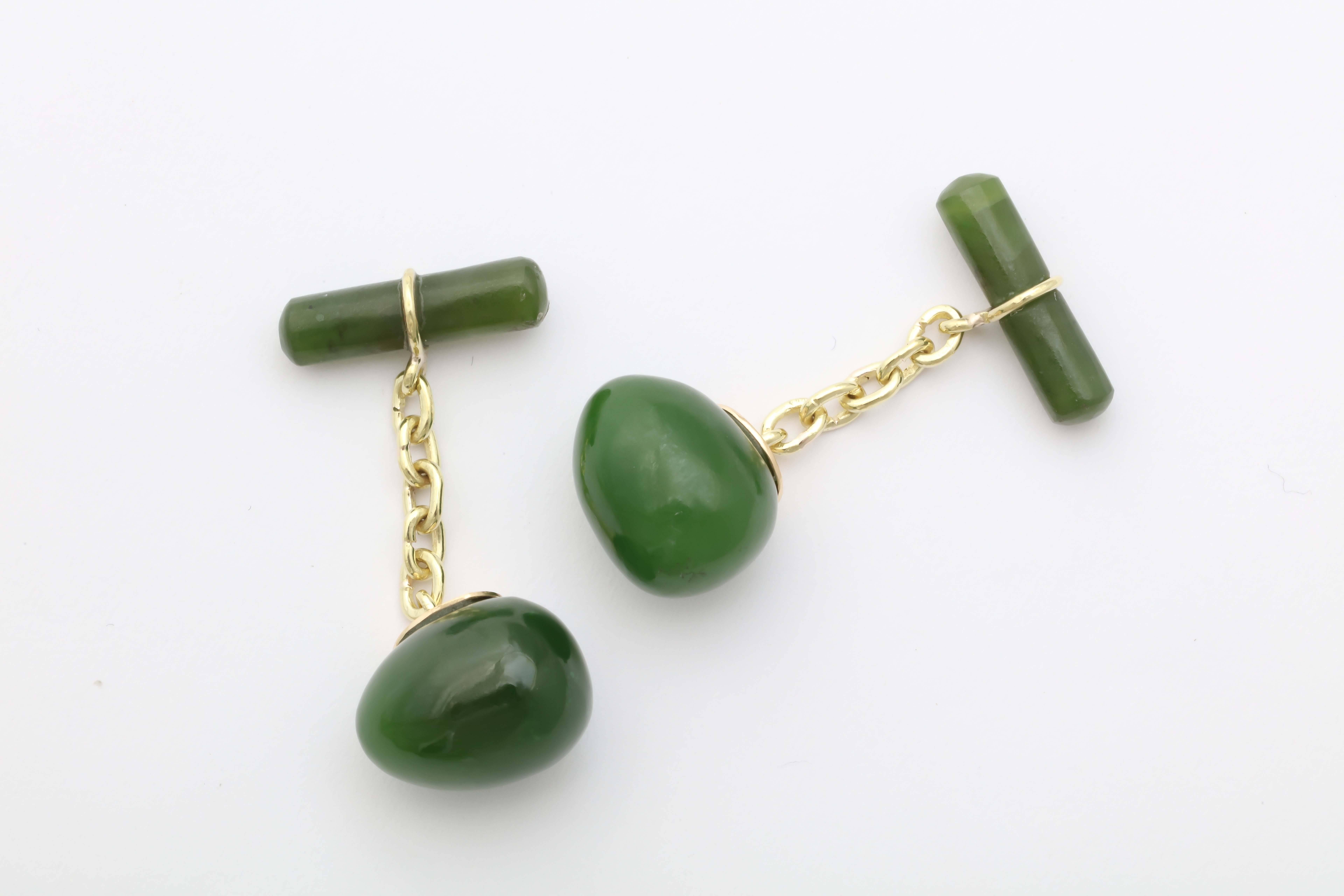 A pair of hand-carved egg-shaped nephrite cufflinks based on a Russian design from 1880 by the Fabergé workmaster, Erik Kollin. The well-matched nephrite links recall the finest Siberian specimens of the 19th century. Each egg is attached to an