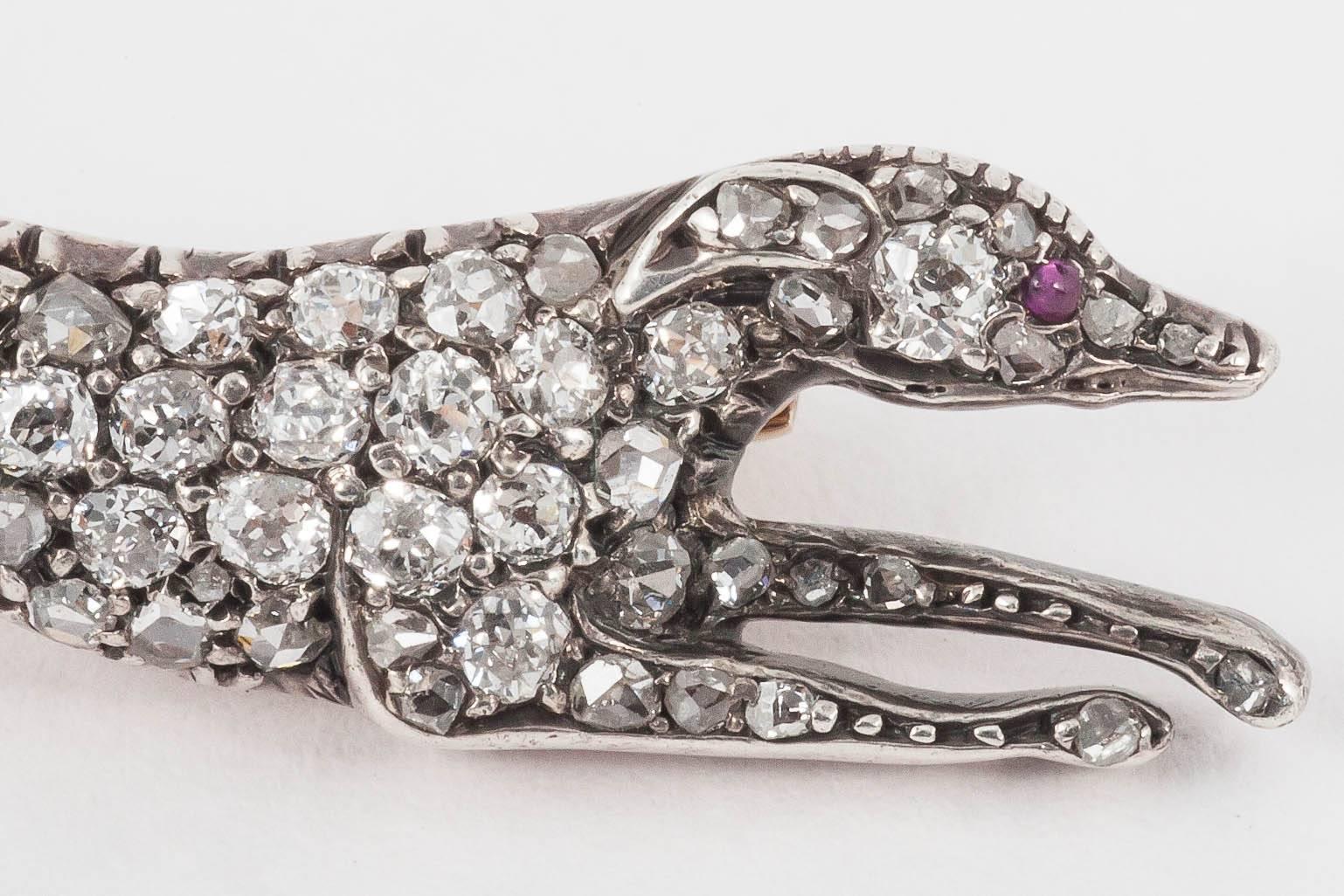 A fine model of a racing greyhound set throughout with old cut brilliant diamonds and rose cut diamonds,mounted in silver and gold.English c 1870-5