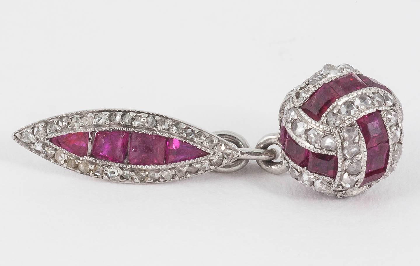 Finely mounted pair of platinum  cufflinks of ball and marquise shaped design,set with shaped burma rubies,and rose cut diamonds,English,c 1910