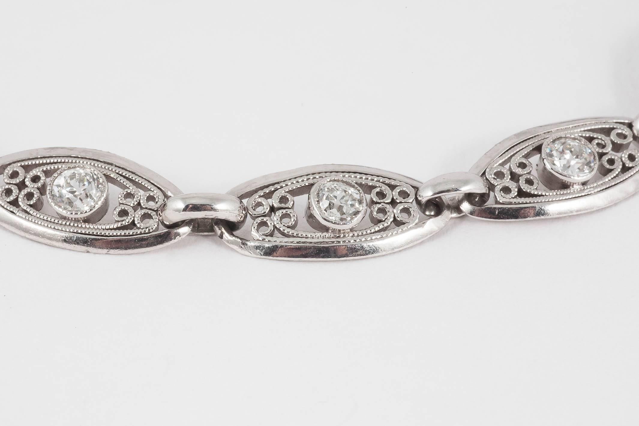 A heavy quality platinum open work bracelet with oval motifs and scrolls, set with old brilliant cut diamonds.
Measures 6mm in width x 20cm in length.
Antique piece (over 100 years old) in the Edwardian style.
Early 20th century, French circa