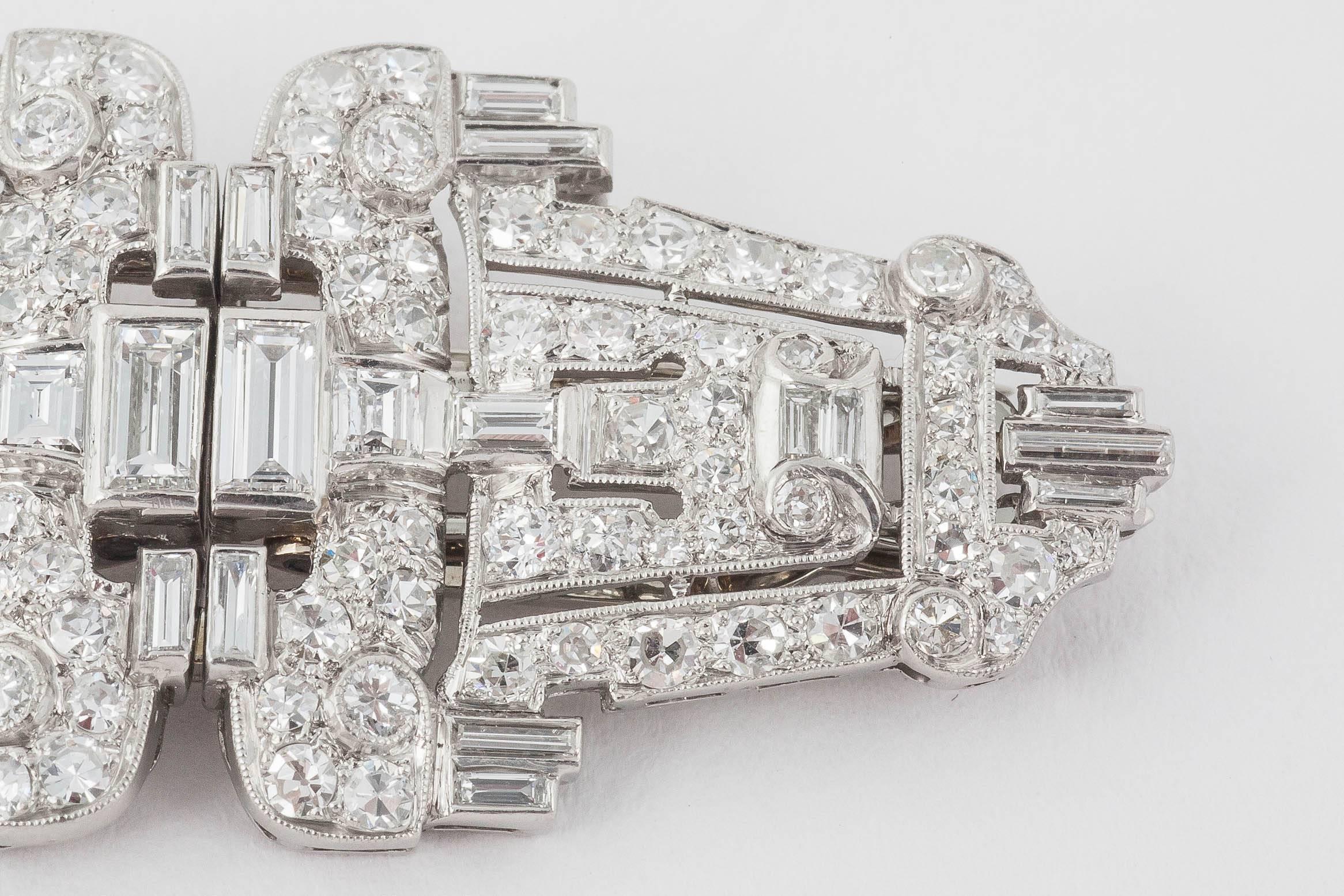 A pair of Diamond double clips with fitting to covert to brooch, The diamonds are of mixed cuts and set in Platinum