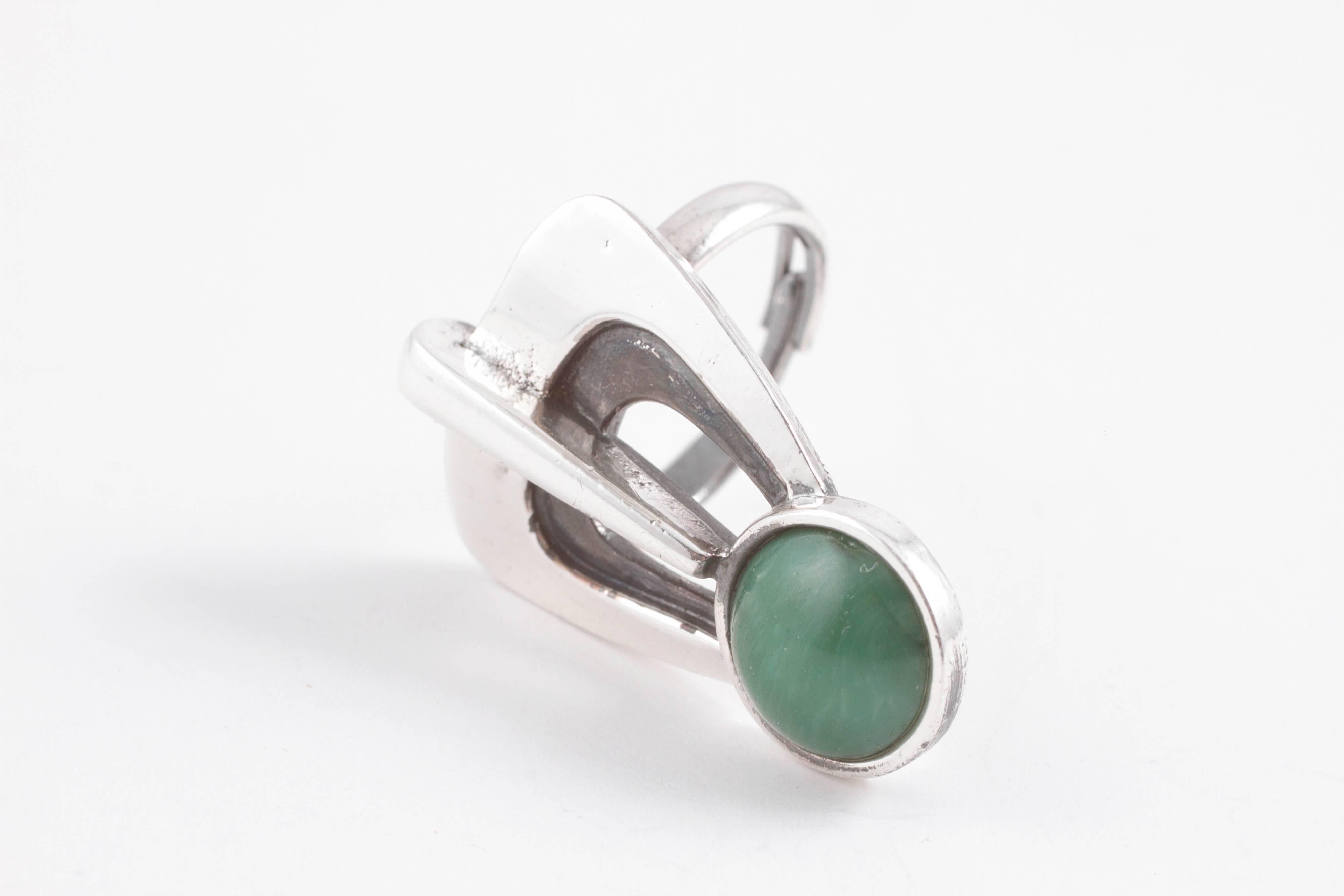 Mid-Century Modern design in silver with green glass simulating malachite gemstone.  A great ring and a bold design.  Size 7