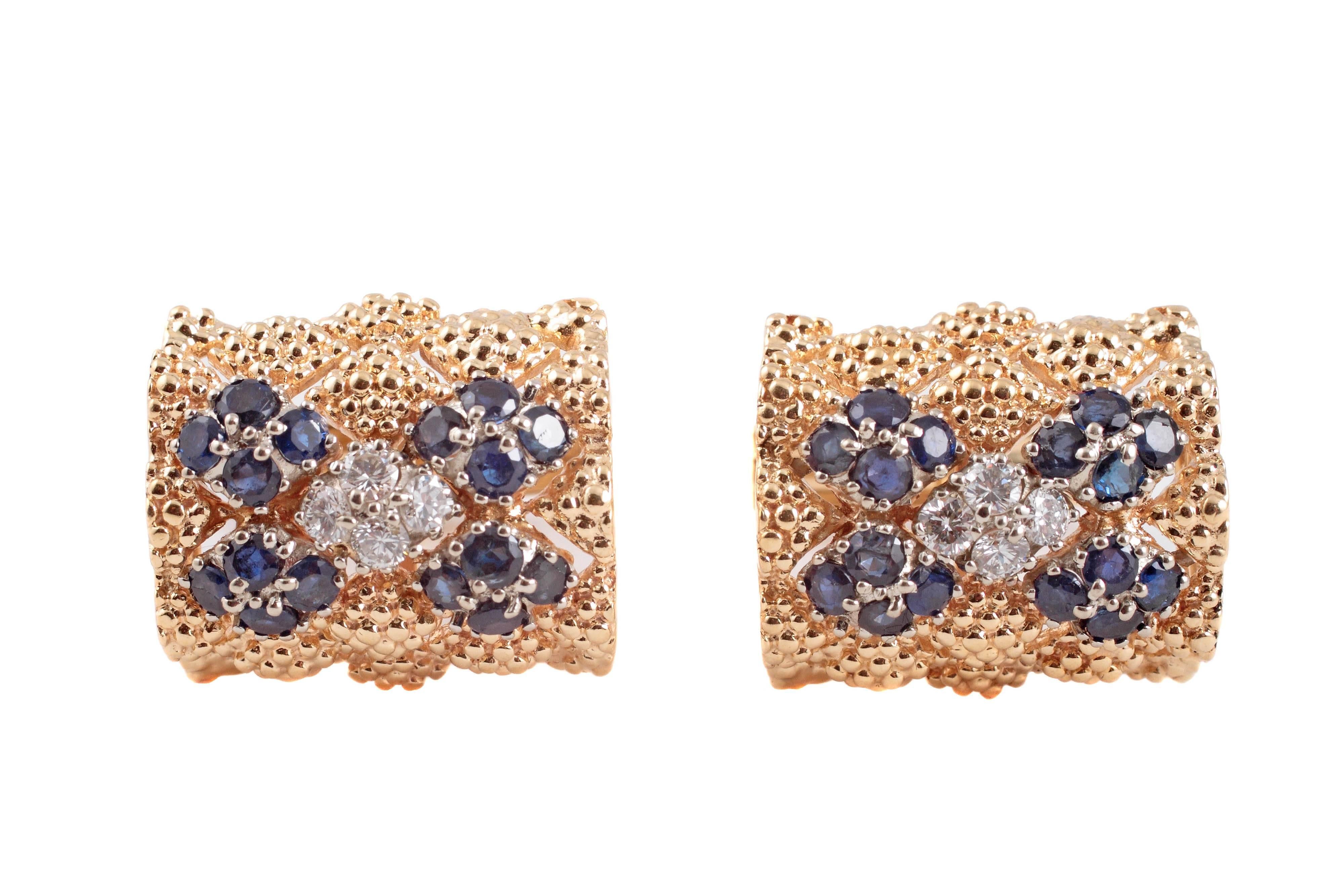 Beautifully raised and textured yellow gold cufflinks centered with small grouping of 4 diamonds cornered with blue sapphires.  The pair makes a great statement for the right man or woman who is confident enough to carry them off.   
