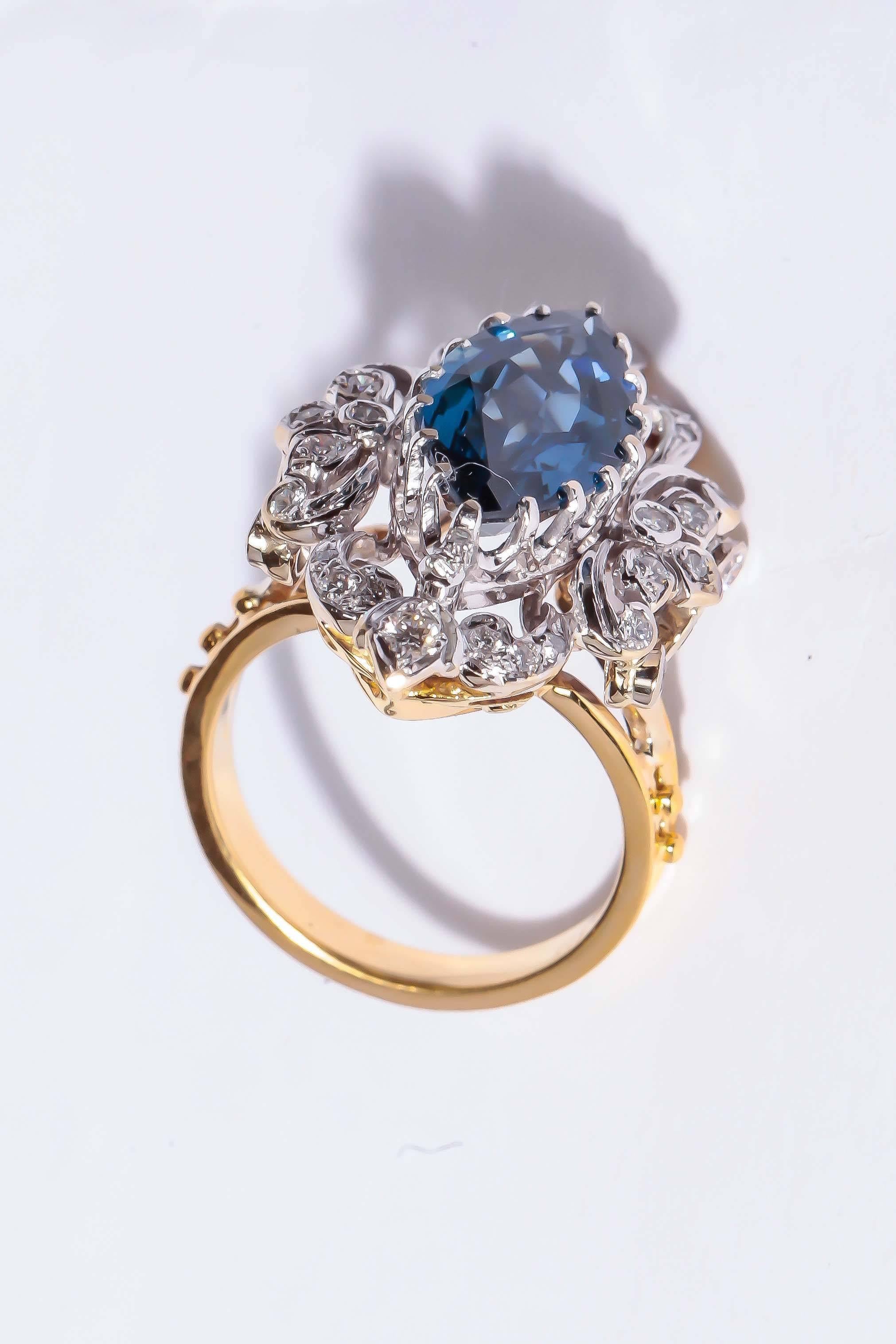 This Victorian reproduction in18K white and yellow gold is, set with one 4.80 ct Marquise cut Sapphire and .60 ct. total weight in diamonds.  

The appeal of antique style jewelry is as timeless as the designs they represent.