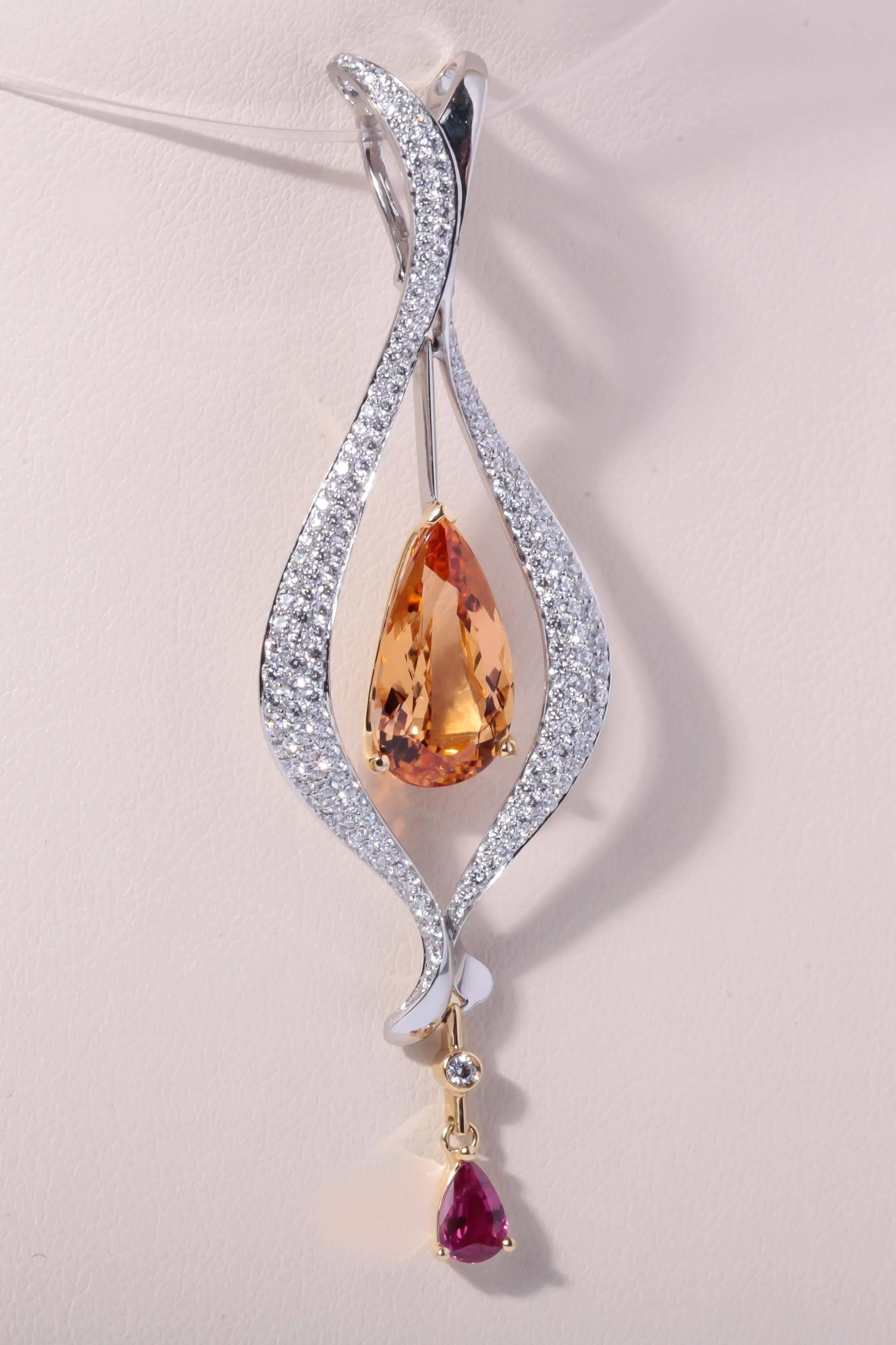 Richard Krementz Topaz set in Platinum and 18 K gold with accent pear shape .47 ct.Ruby.  Brazilian Topaz weighing 5.43 ct. surrouned with 1.41 cts of pave diamonds.  For 140 years, the Krementz family made fine jewelry of exceptional quality in