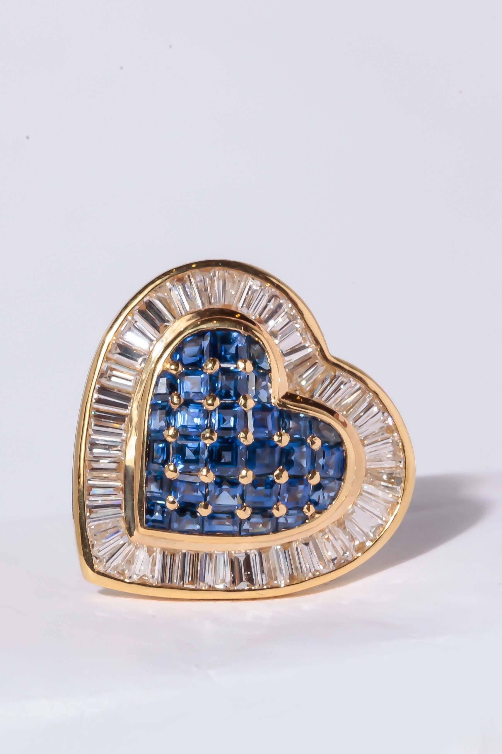 These 18 Carat yellow gold earrings are set with 60 square cut Gem quality Sapphires and are surrounded by 84 tapered diamond baguettes.  For a total weight of 2.50ct. of sapphires and 1.41 ct. of diamonds F-G color VS Clarity. The omega backs have
