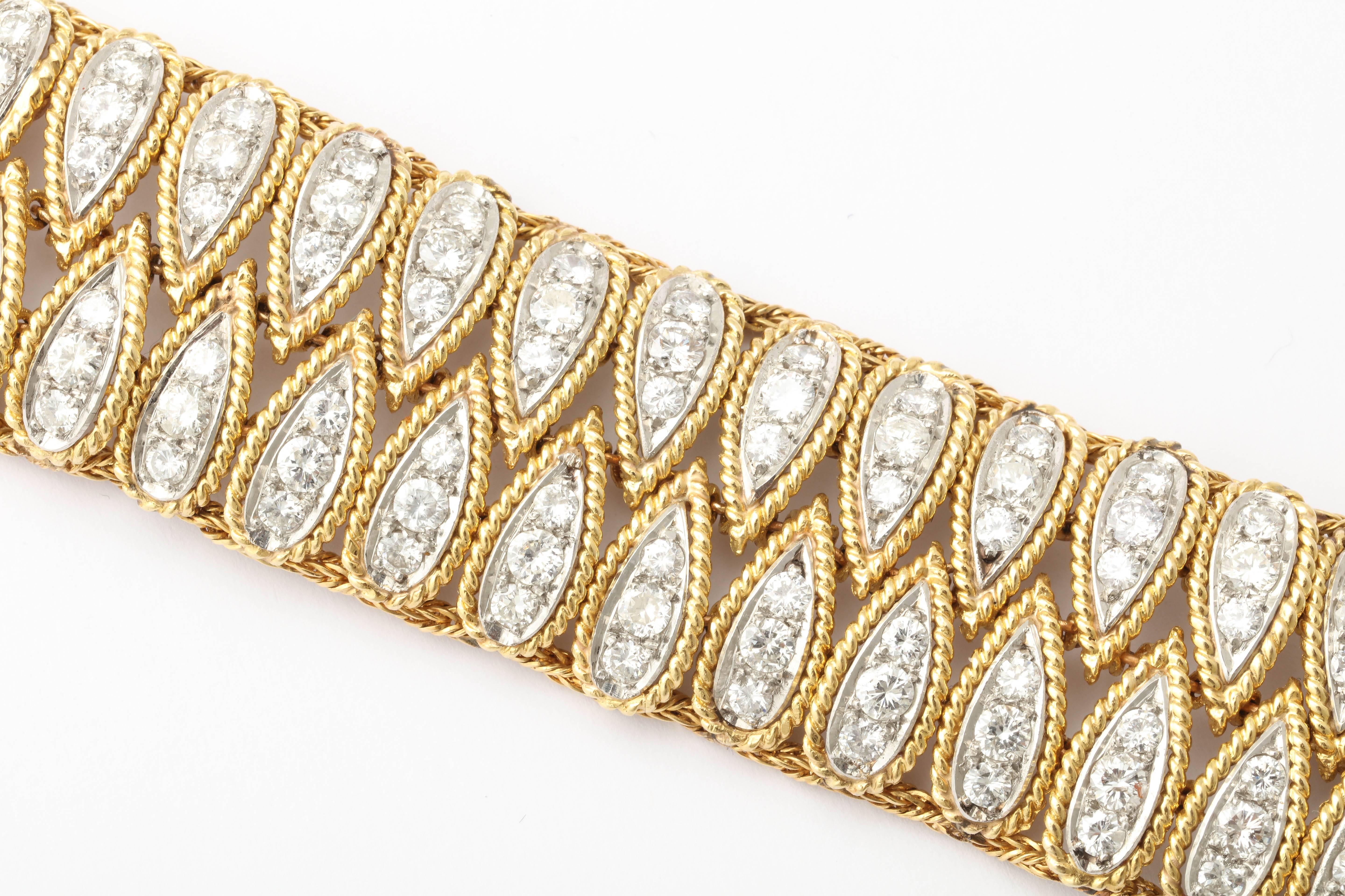 Handmade 18kt Yellow Gold & Diamond Bracelet with alternating segments of Pear shaped elements 150 full cut clean 7 white stones.  Well over 10cts  Very elegant and luxe. They don't make them like this anymore.
