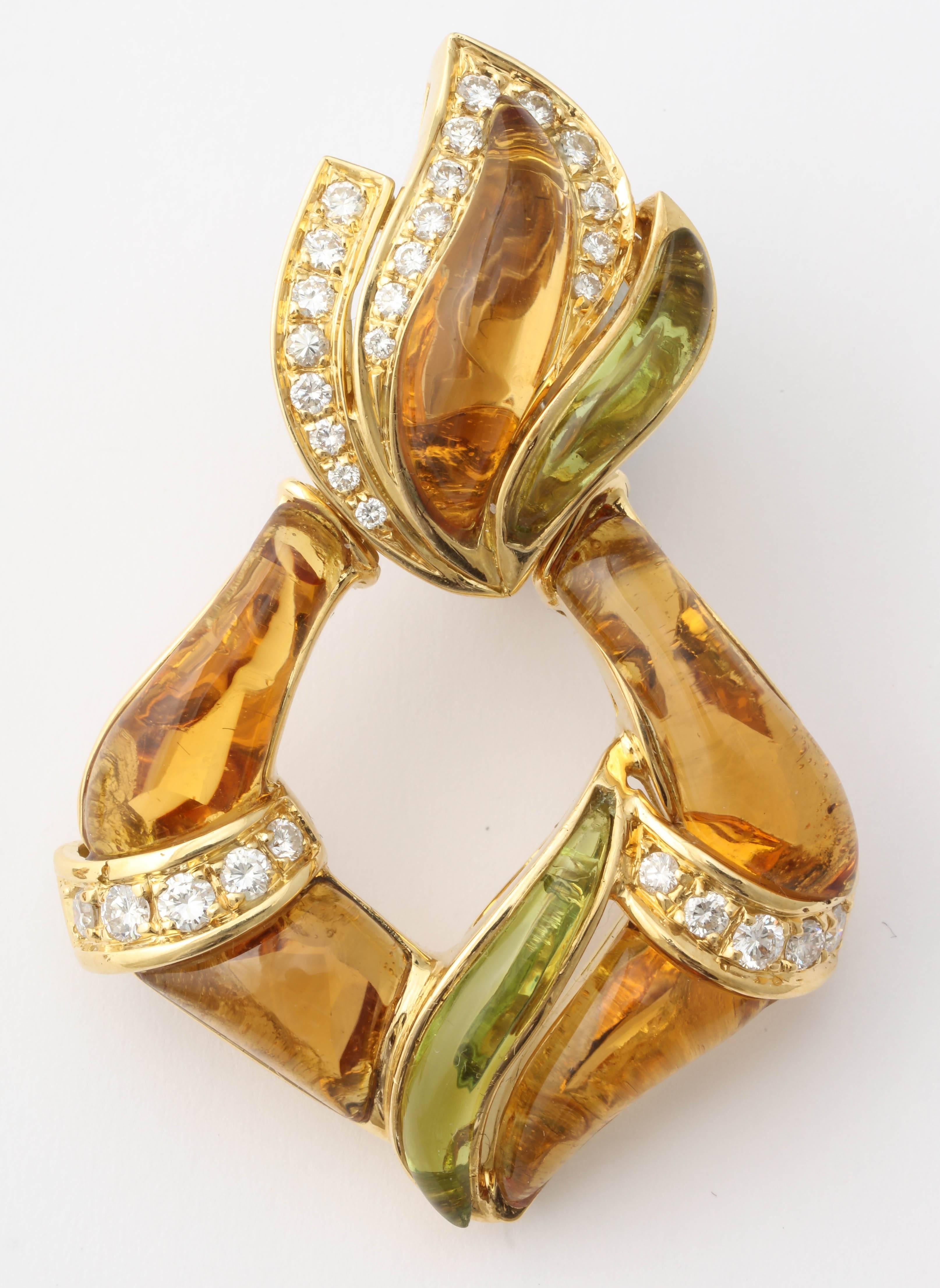 Spectacular 18kt Yellow Gold -Omega back and Post hinged Earrings.
Hand carved with inset Citine & Peridot stones separated by bands of Prong set Clean, full cut & super white Diamonds.
Very Romantic & overblown.  Reminiscent of old Marina B