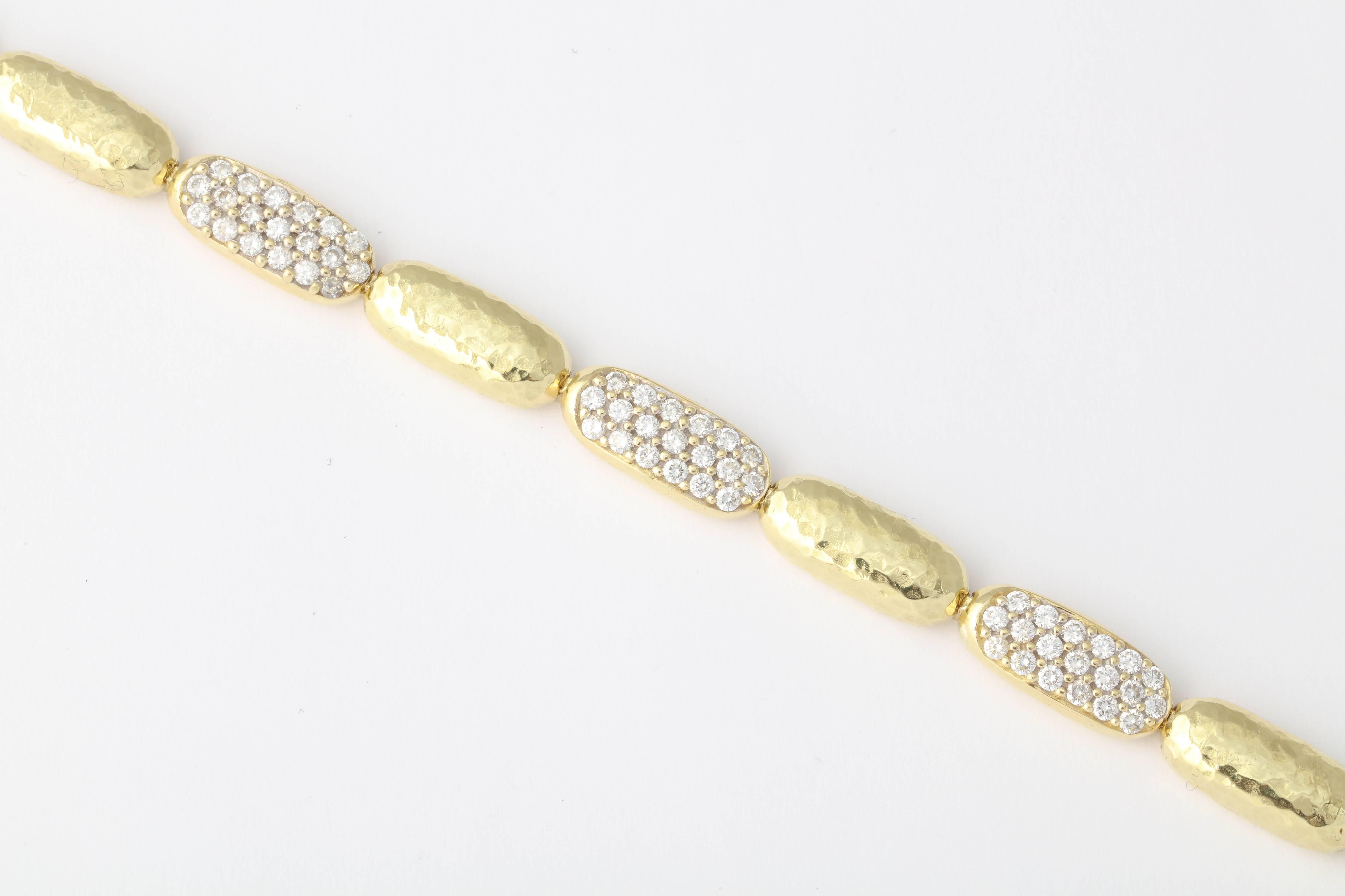 Alternating 18kt Yellow Gold Hammered Oval links with Pave Diamond links. Over 3.5 carats of full cut clean & white Diamonds.
  Just that little extra bit of bling to play off your Cartier watch or Hermes gold Bracelet. So chic &  oh so cool!