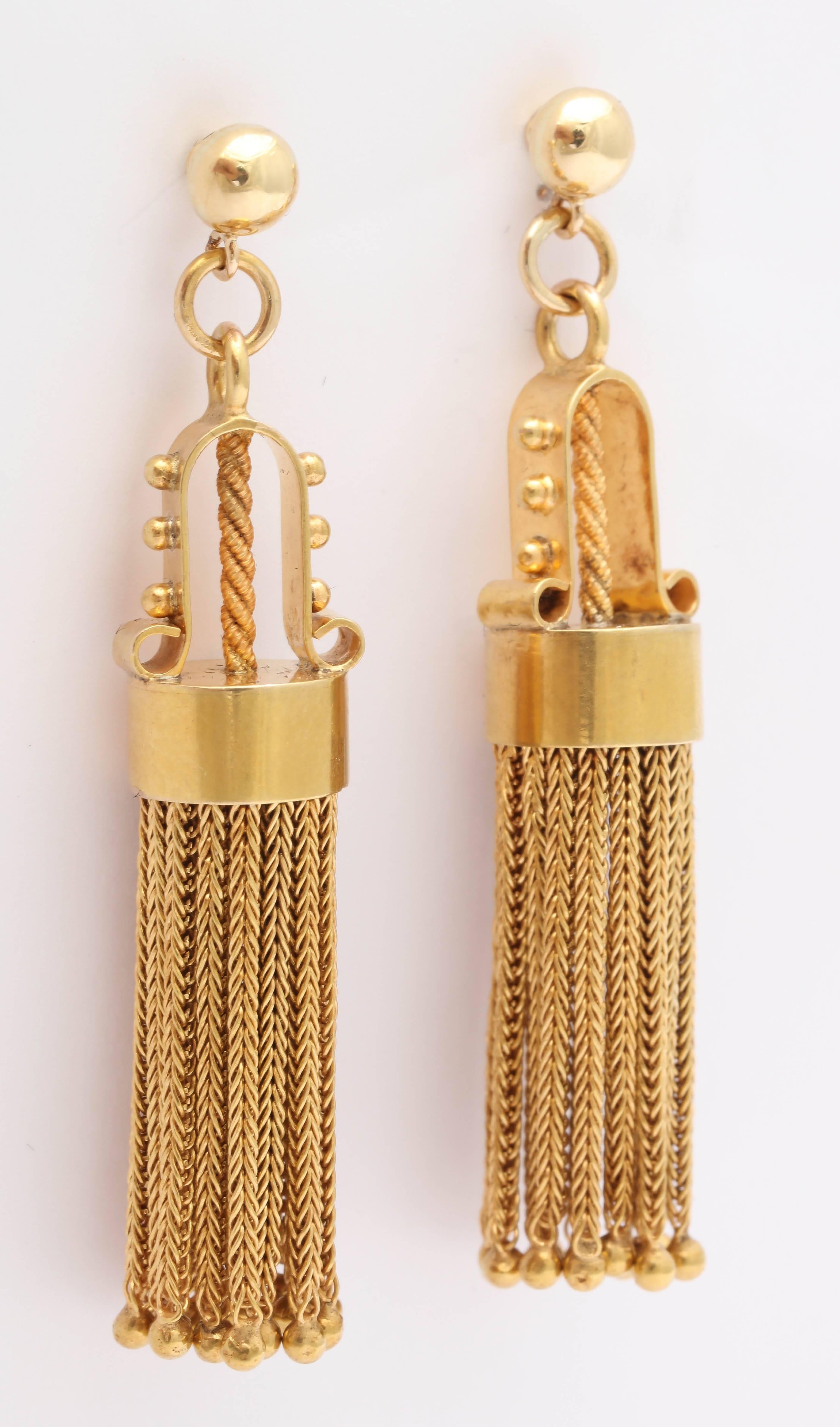 14kt Yellow Gold Pierced Earrings - highly stylized and unlike any that you have ever seen.  Circa 1950 but look1850.  Antique looking yet very modern and updated.
Tassels terminate with a gold ball bead attached to a foxtail chain. Are presently