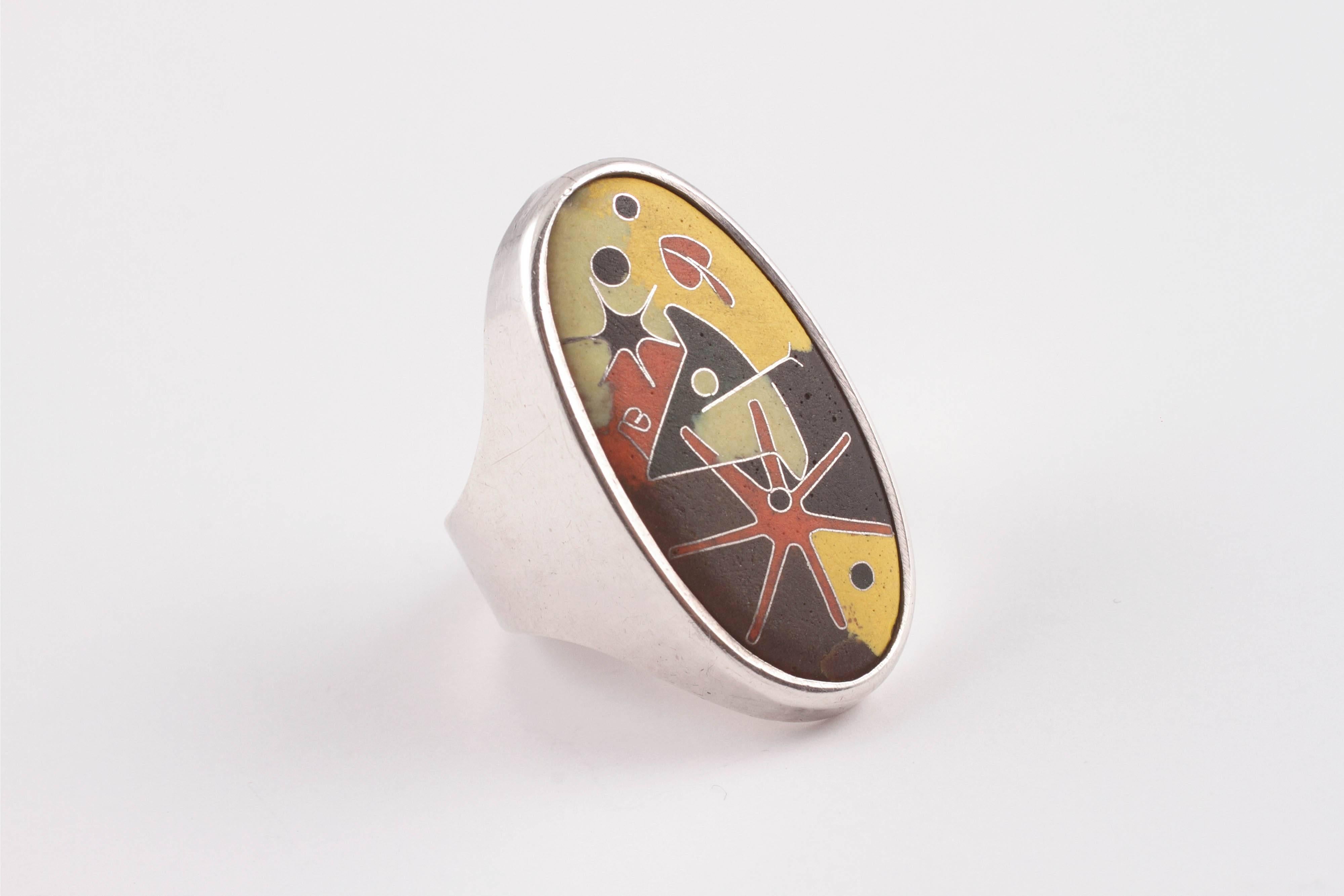 A late-Century German Modern Silver ring with enamel design in a painterly fashion.  The bold pattern and splash of color create a whimsical feel for anyone wearing or enjoying this jewel.  Size 7 1/2.