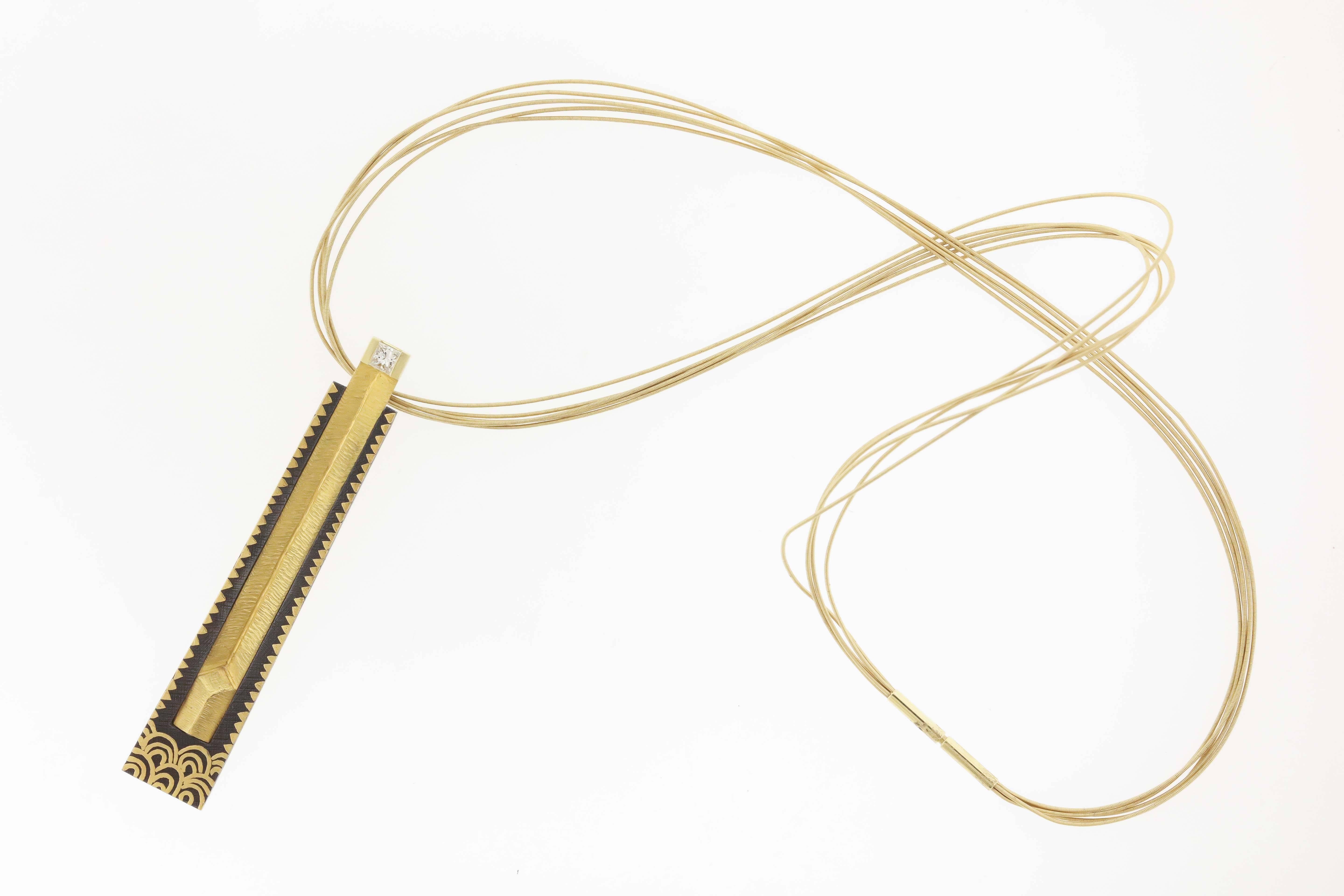 NaMu Cho is a master jeweler whose use of damascene steel, gold and diamonds in his very modern style is acclaimed and collected.  This necklace, titled Mirage 8, is a column of 22K gold, 24K gold and 18K gold, measuring 3/8