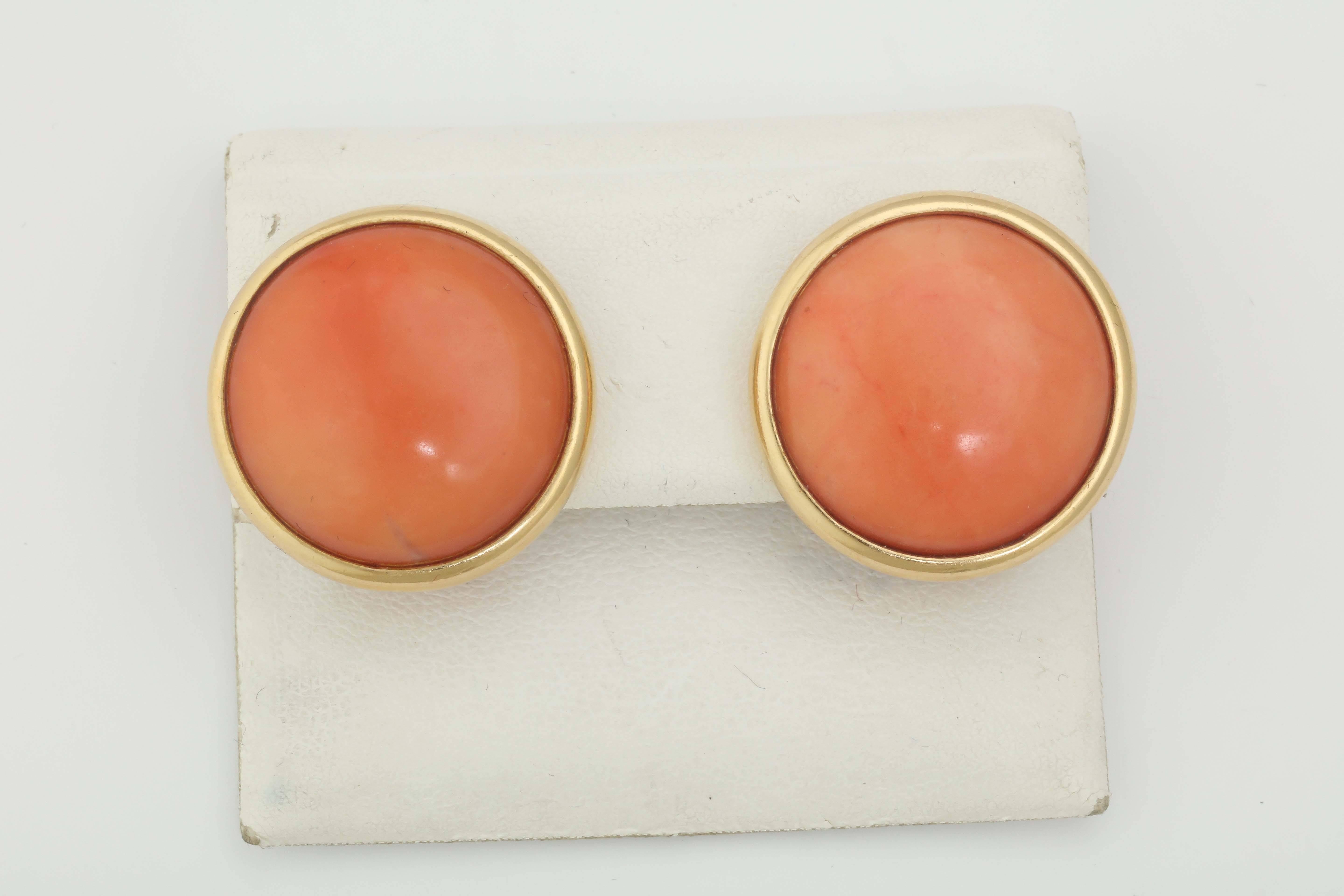 14kt Yellow Gold Clip-On Earrings Consisting Of [2] 25MM Bezel Set Angel Skin Coral Stones & Exhibiting Beautiful Floral Design Open Work Craftmanship In The Back Of The Earclips. NOTE: Posts May Be Added For Pierced Ears. Signed By Tambetti