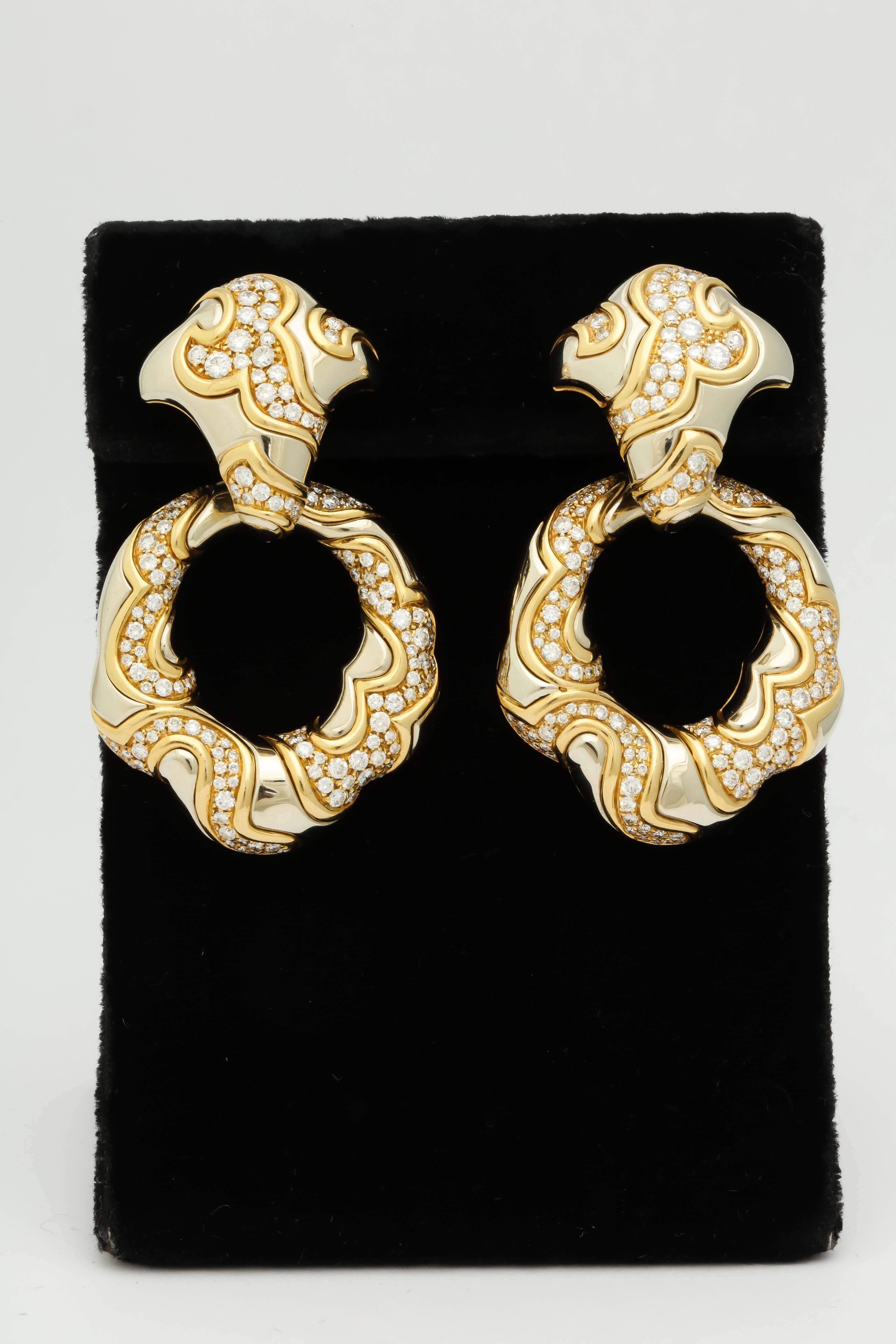 18kt Yellow & White Gold Day And Night Convertible/Detachable Important DoorKnocker Earrings Embellished with Approx. 10Cts of Superior Quality Full Cut Diamonds And Designed With An Abstract Puzzle Design Gold Workmanship. NOTE: Bottom Loops Of
