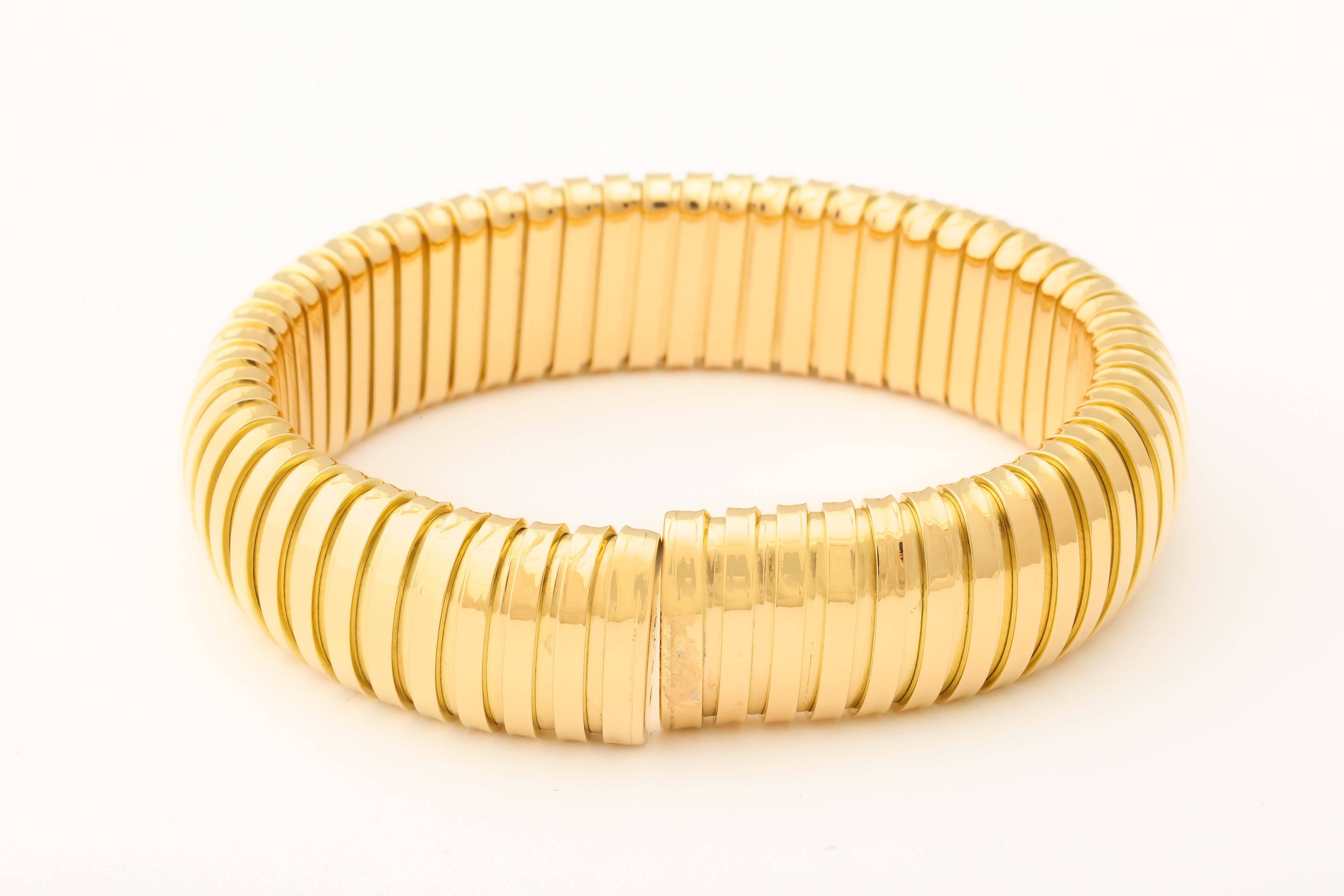18k Yellow gold Tubogas spring loaded bracelet  16mm wide 7.25 deep
17 cm circumference 37.4 grams