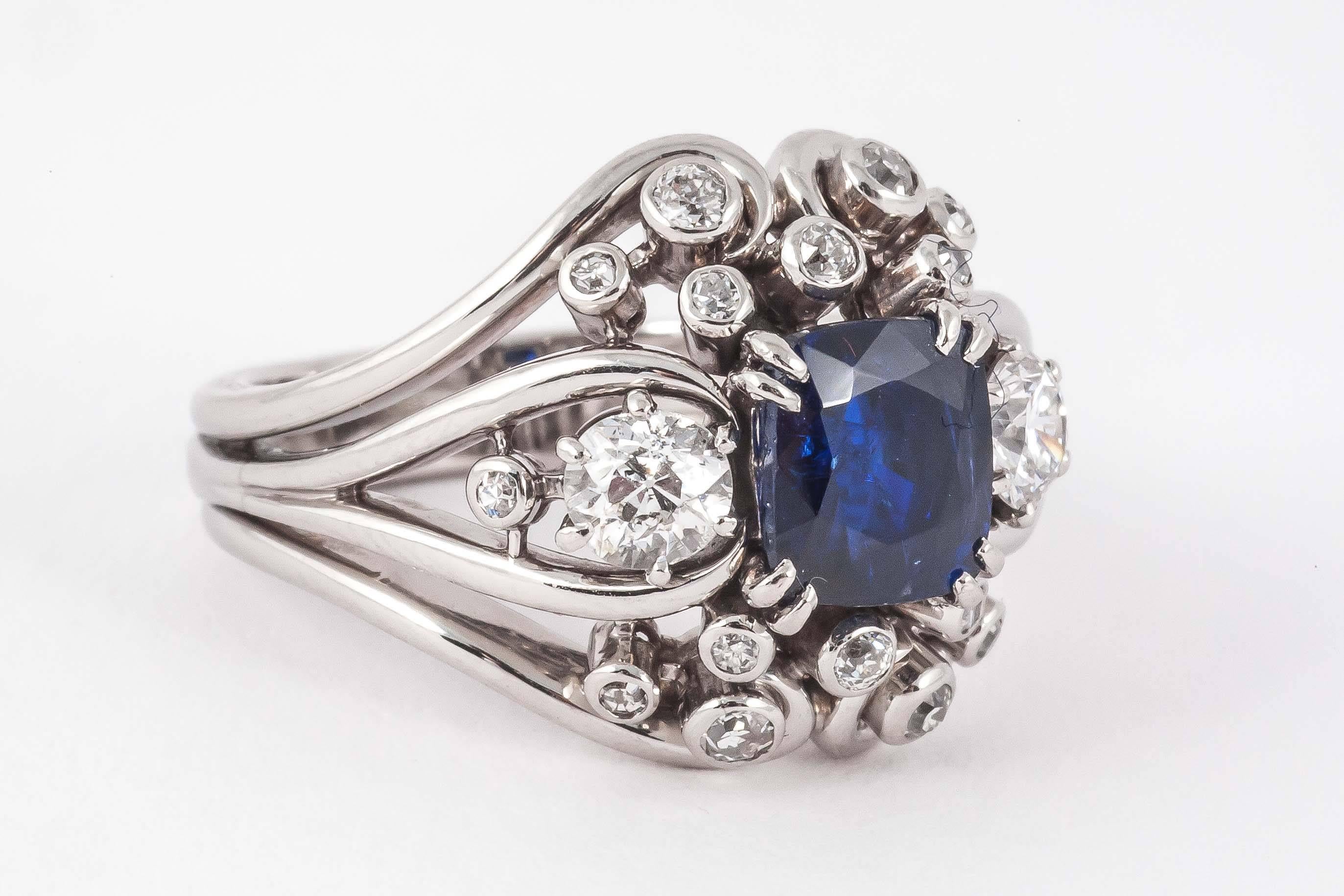 Natural Burma Sapphire surrounded by Diamonds set in Platinum
Ring size K
