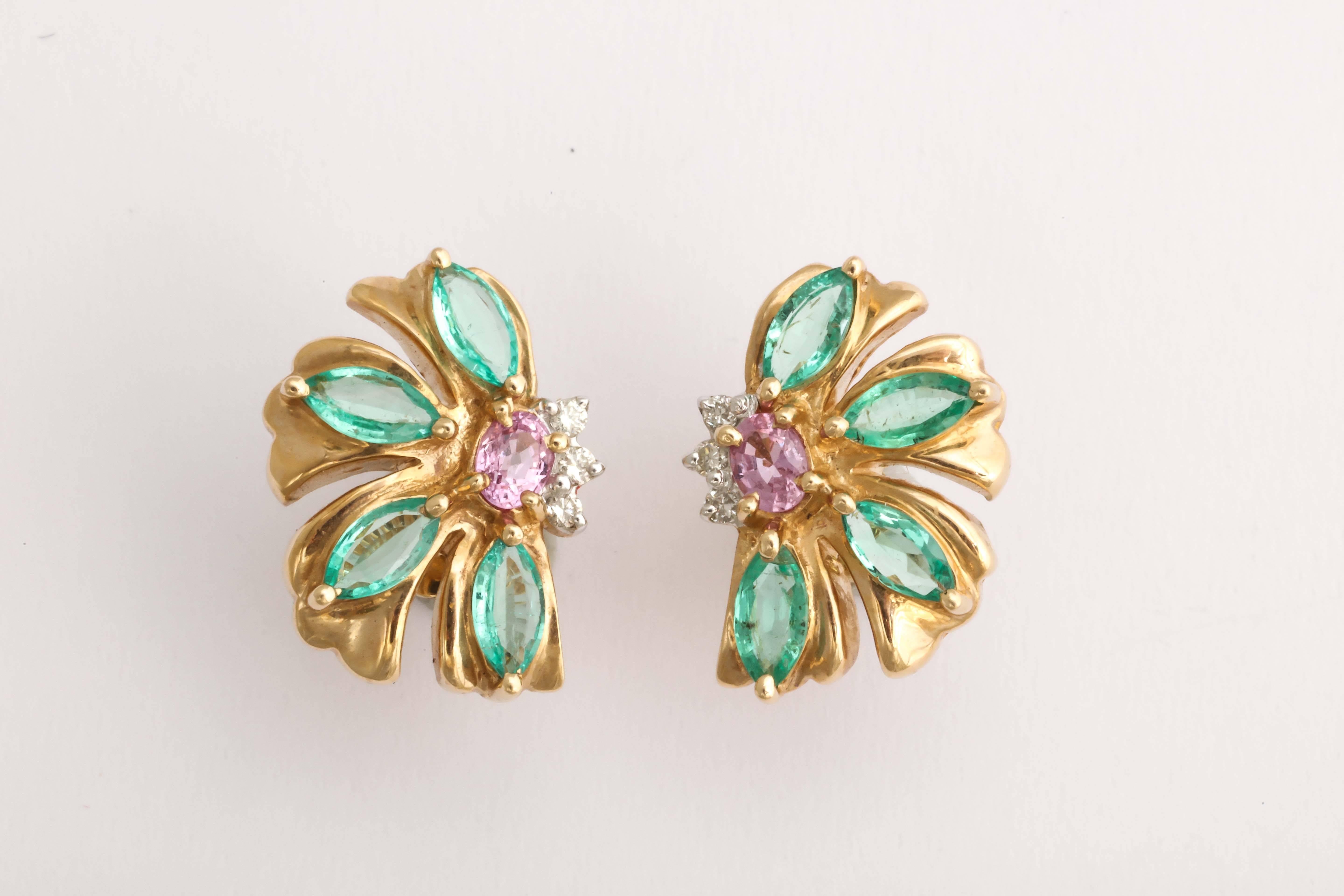 These earrings are a beautiful color combination, the classical green and pink, accented by sparkling diamonds and bold 14 kt yellow gold. The design is asymetrical and frames the face.